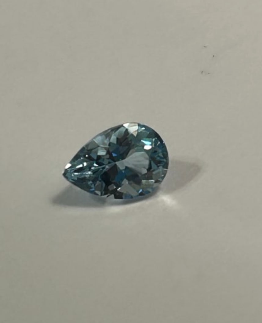 Natural Sky Blue Topaz 1.72ct Pear Cut From Brazil: This Sky Blue Topaz from Brazil is a vibrant, light blue gemstone often compared to aquamarine. Featuring excellent cut and clarity, this pear-shaped stone is ideal for pendants or rings due to its