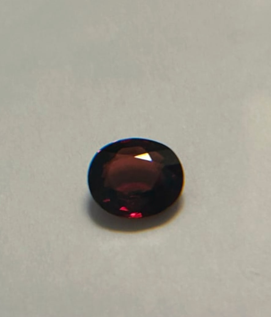 Natural Almandine Garnet Full Fire! 1.97ct Oval Cut From Mozambique: featuring a vibrant, fiery red color and a classic oval cut. Mozambique garnets are particularly renowned for their rich, deep red, ruby-like hues. Daisy Approved.