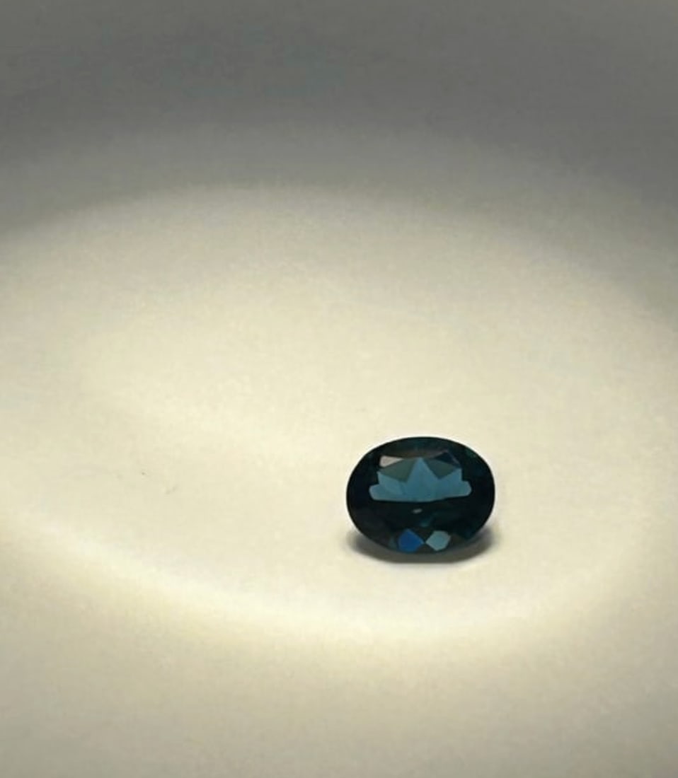 Natural London Blue Topaz 2.18 ct Oval Cut r from Brazil 9.09 x 7.20 x 4.52mm: a deep, dark grayish-blue color, often with slight teal undertones. Renowned for its high-quality, eye-clean clarity and exceptional brilliance.