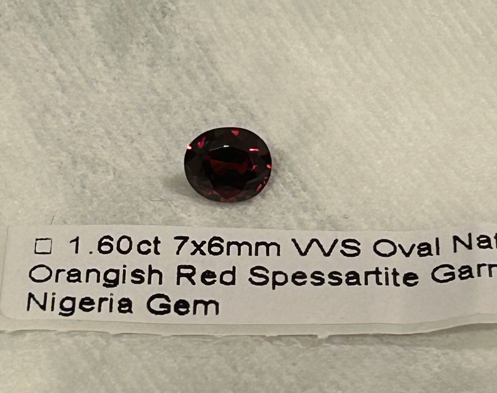 Orangish Red Spessartite Garnet Oval Cut VVS 1.6ct from Nigeria: This stones vibrant, manganese-caused orange-to-red hue, high clarity for its type, and rarity, its a desirable collector's stone, often sought after for its intense color like Mandarin Garnet,