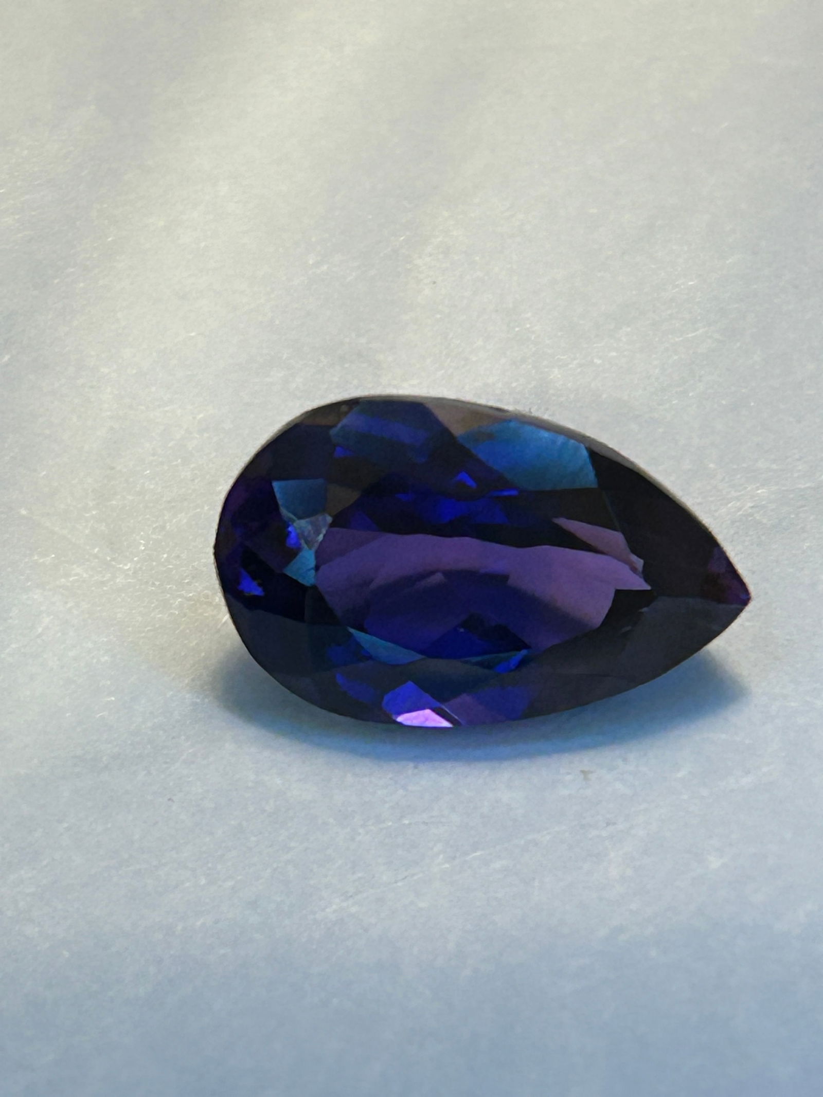 Natural Extremely Rare PURPLE Tanzanite 7 Ct Pear Cut: Untreated purple Tanzanite, a highly rare, single-source gemstone from Tanzania featuring intense violet-blue hues. Pear-cut with high clarity, it is a collector-grade investment piece known for
