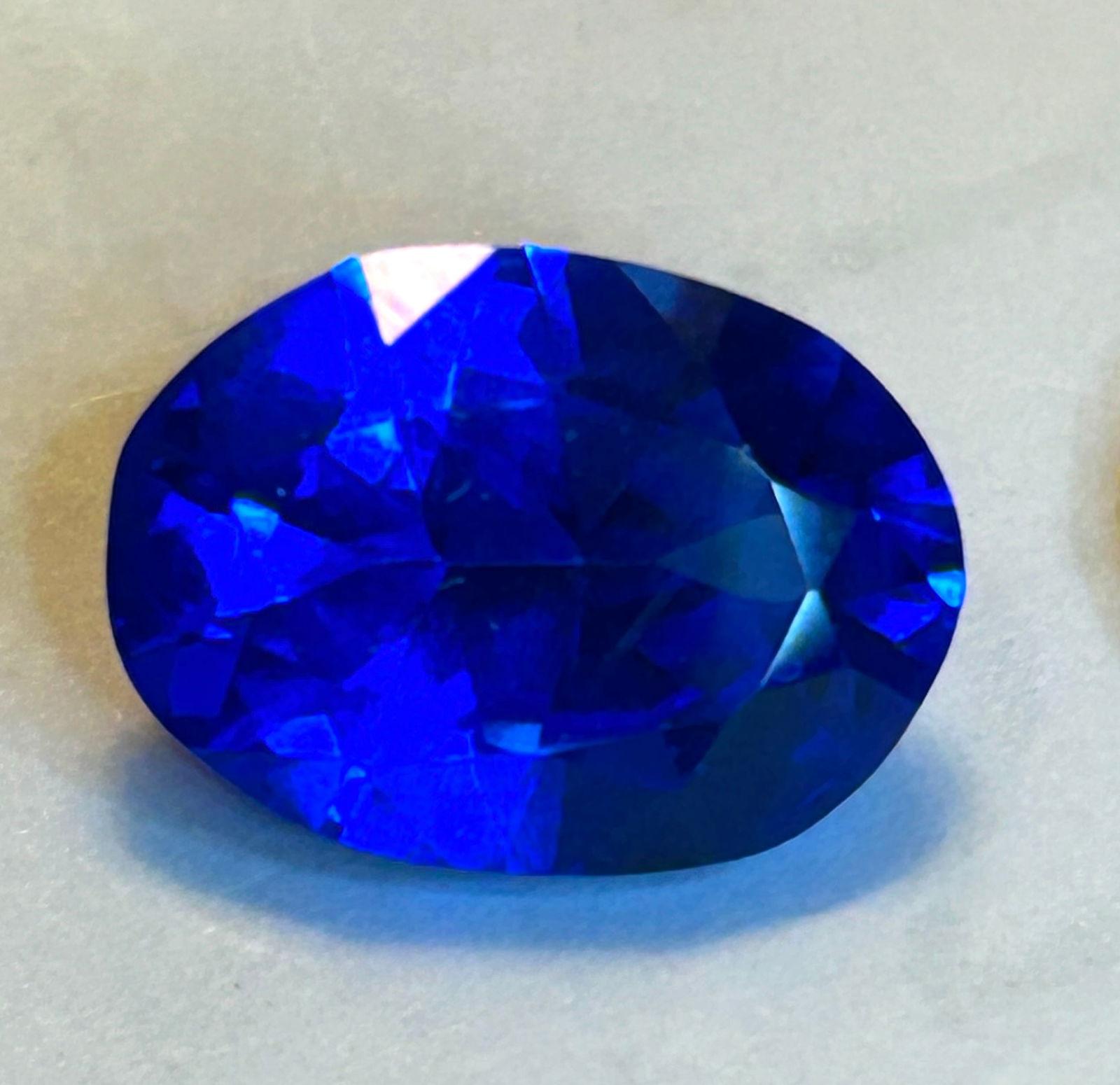 HUGE Royal Blue Sapphire OVAL Cut 10.44 Ct from Sri Lanka: A highly prized gemstone, characterized by its deep, vivid royal blue color, exceptional clarity, and brilliant sparkle due to its precise cut, making it a valuable collector's item and a magnificent