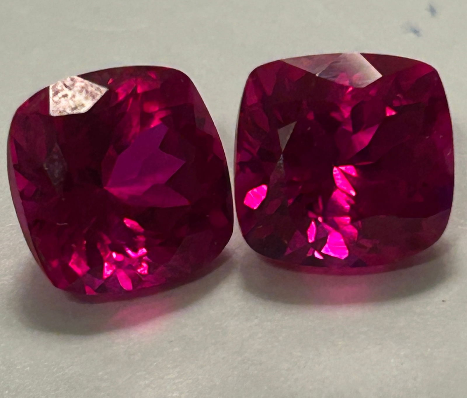 Pink Ruby Cushion cut PAIR 5.2ct each vvs from Burma: Rare pair of large, flawless, cushion-cut pink rubies from Mogok, Myanmar, they are nearly transparent, showcasing pinkish-red intense color, excellent brilliance from the cut, and immense value due
