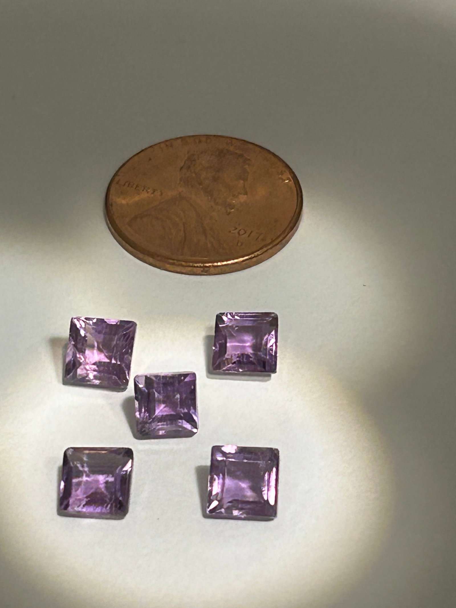 5 Purple Amethyst 4.5ct tcw Princess Cut: features square-modified brilliant cuts with superior light performance. Eye-clean with deep, rich purple hues, these stones are durable (Mohs 7) and ideal for vibrant jewelry, showcasing blue