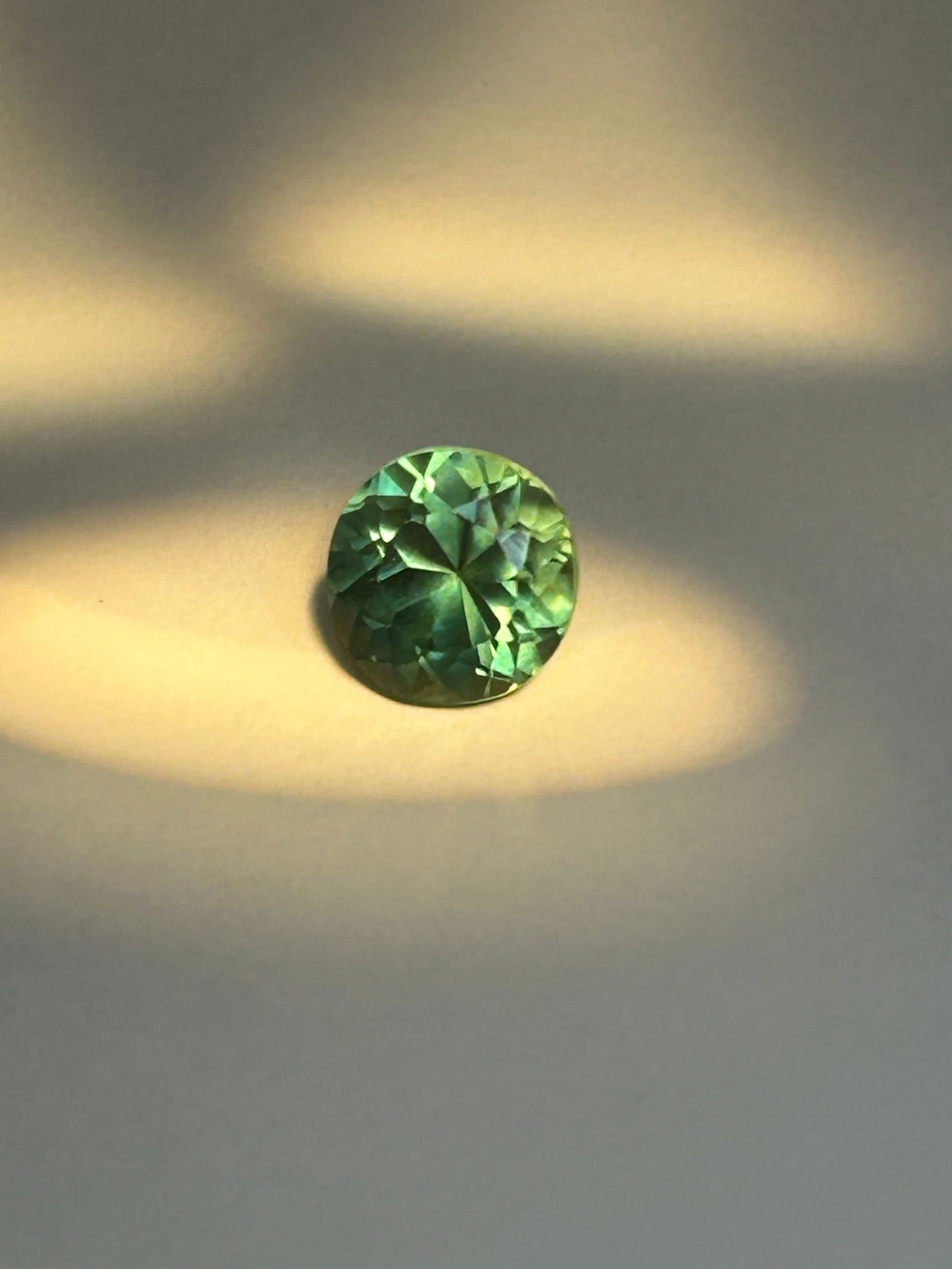 Green Sapphire 3ct Round Cut from Sri Lanka GIE Certified: Characterized by a crisp, vibrant green hue with excellent clarity (often eye-clean or VVS), colored by iron. These stones feature premium, precise faceting to maximize brilliance and are prized for