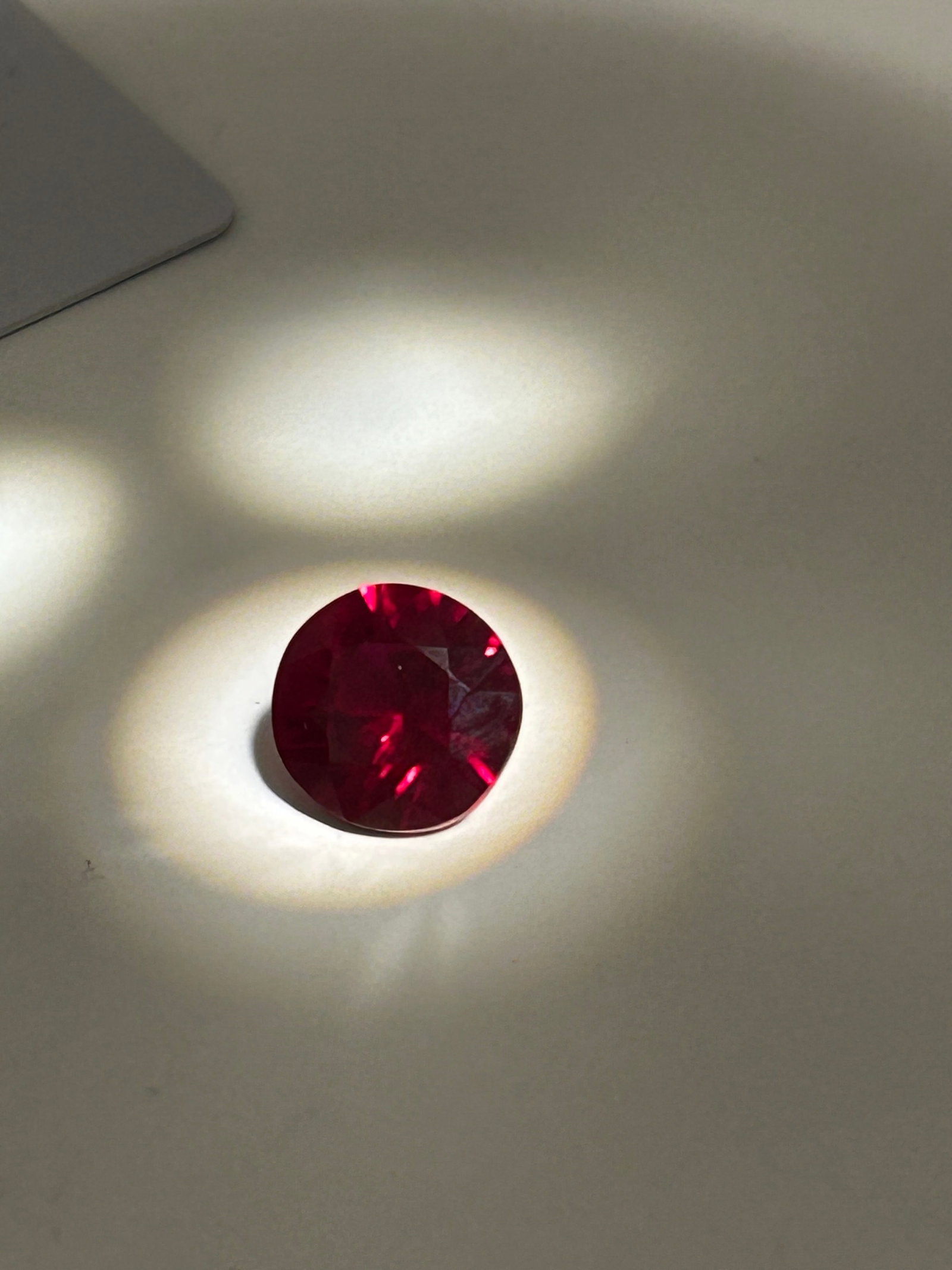 Beautiful Myanmar Ruby 10.7ct Round Cut No Reserve GIR Certified: Untreated Burmese red ruby, featuring a vibrant, deep red color often described as pigeon blood red. The stone is expertly cut into a round, faceted shape—often in a brilliant-cut style—to maximiz