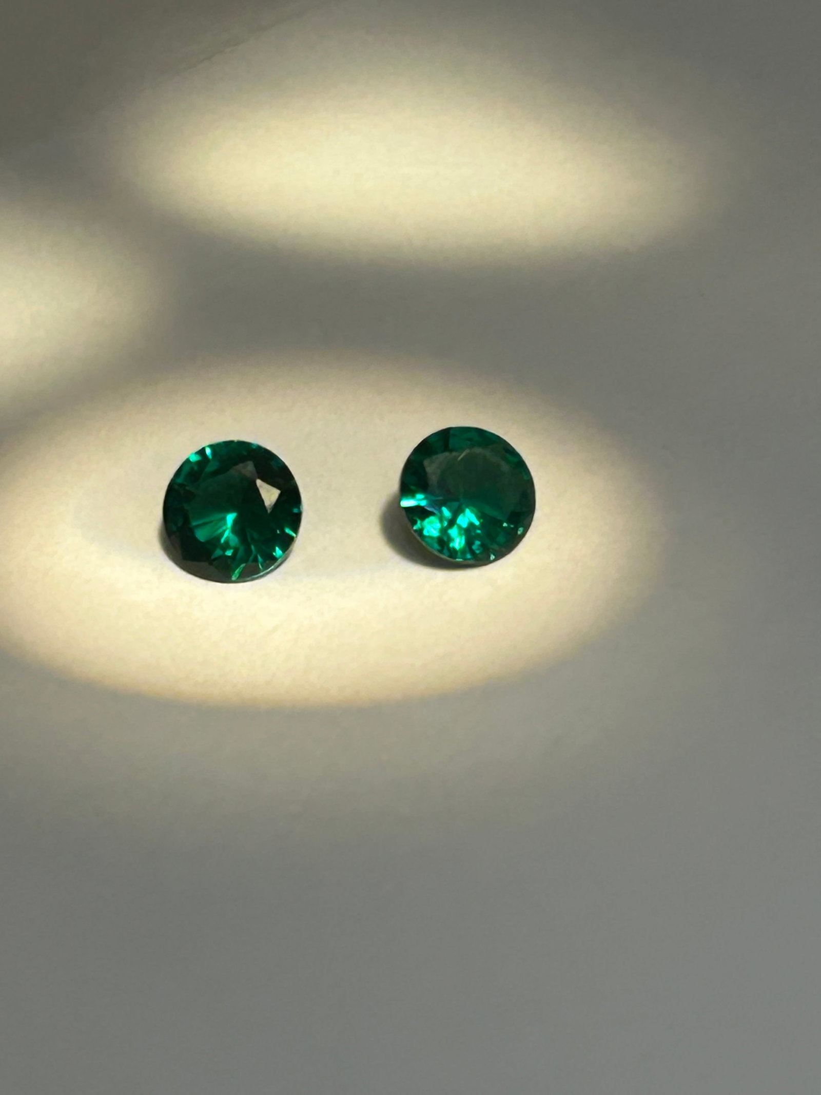 Colombian Green Emerald 2 ct Round Cut PAIR 6mm No Reserve: highly coveted for its intense, vivid green color. These stones originate from famed Colombian mines, boasting superior transparency and, when round-cut,, an enhanced, brilliant sparkle compared to tr