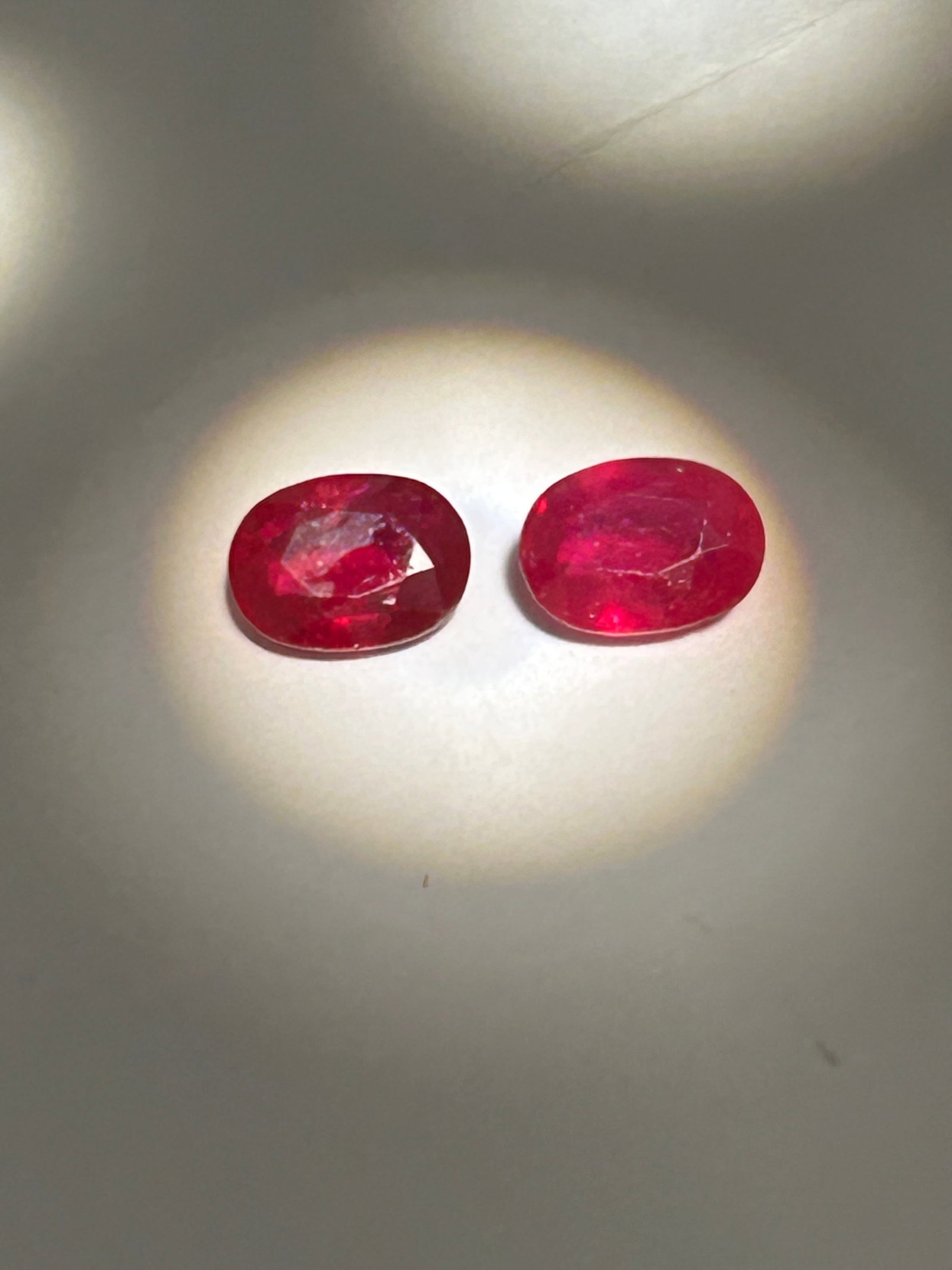 Flawless Natural Mogok Pink-Red Ruby 2.5 tcw Oval Cut No Reserve: A highly sought-after pair of premium gemstone sourced from the fabled "Valley of Rubies" in Myanmar. These rubies are renowned for their intense, vibrant color and exceptional clarity.