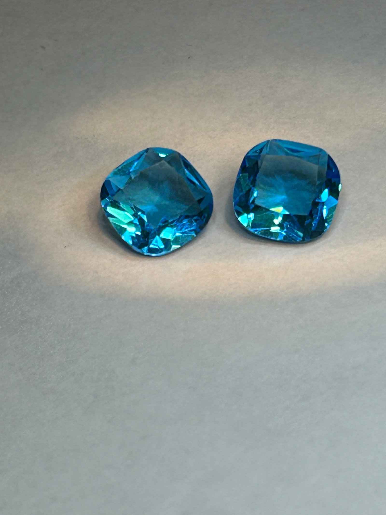 Aquamarine 6ct PAIR Cushion Cut IGL Certified No Reserve: Approx. 3ct each, cushion-cut aquamarine gemstones features a soft, square, or slightly rectangular shape with rounded corners and large facets, offering a vintage "pillow" look. Known for icy-blue hu