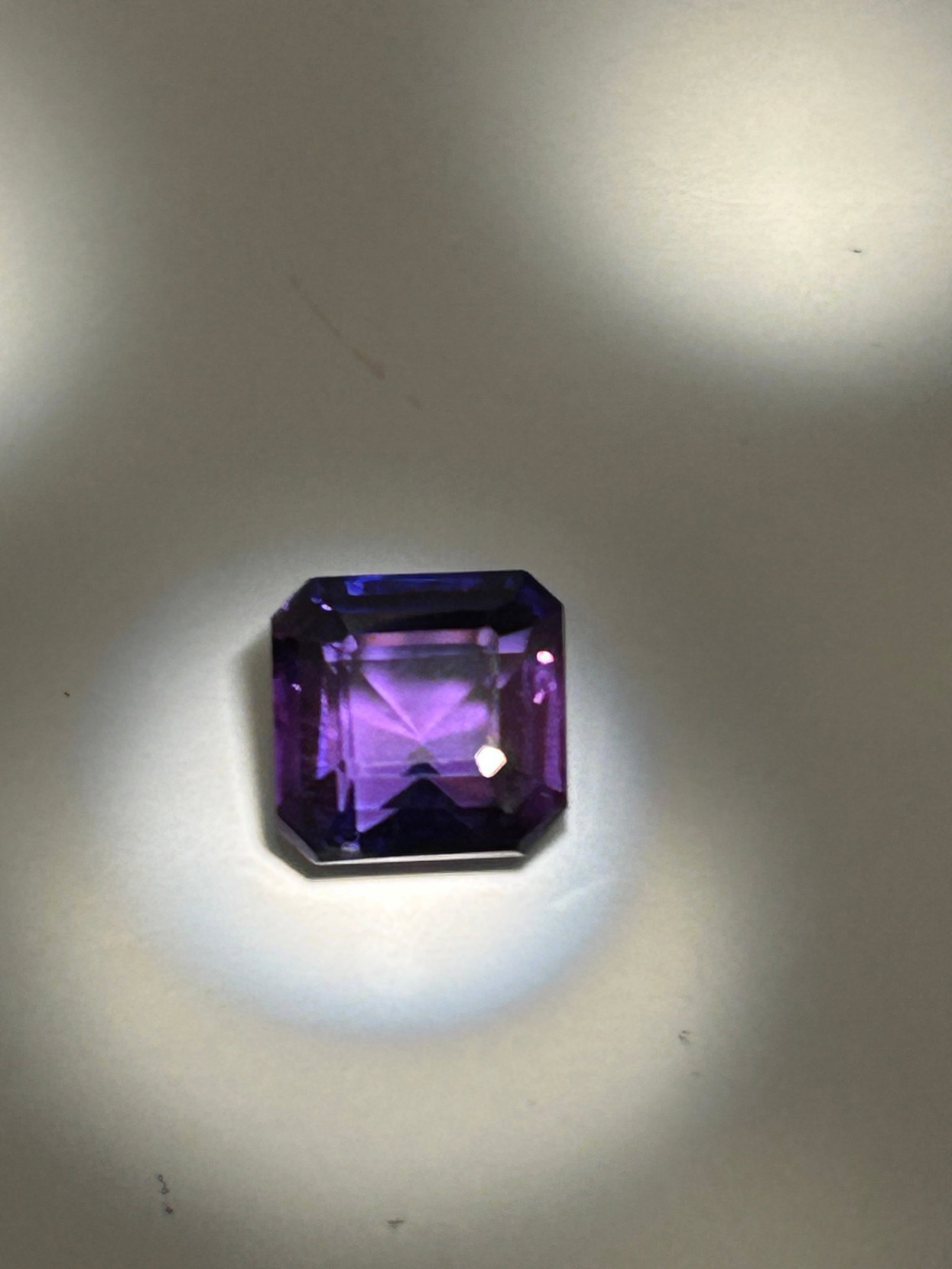 11.65ct Brazilian Deep Purple Amethyst Emerald Cut No Reserve EGL Certified: a high-clarity, naturally sourced gemstone from Brazil. It displays a rich, intense purple color, often with strong color saturation and high-quality transparency. This large, faceted, rectangular-cut
