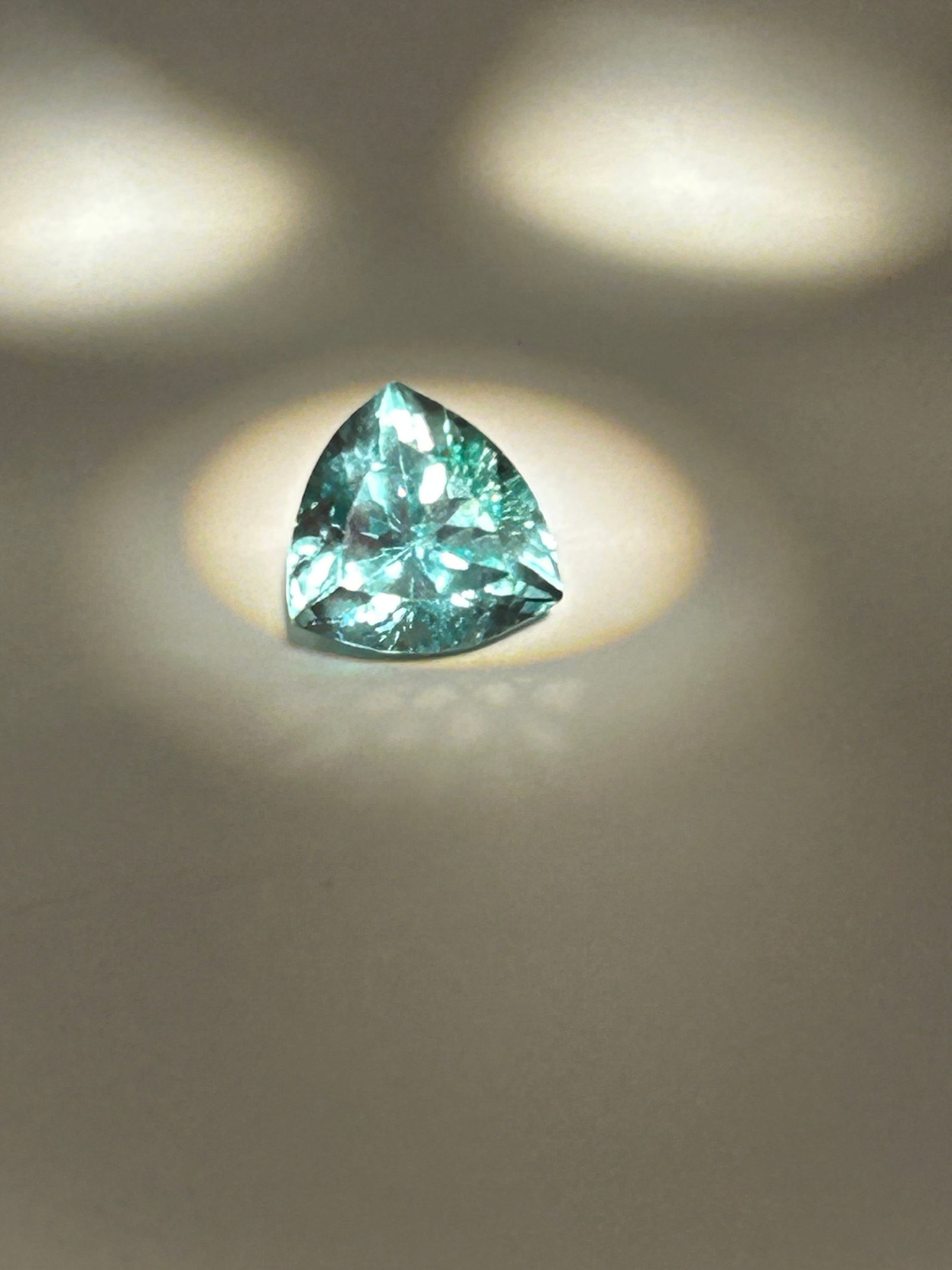 8.9ct Montana Green Sapphire Trillion Cut, No Reserve, EGL Certified: Triangular-shaped gemstone featuring 40-50+ facets for high brilliance. It generally displays a vibrant green tone. Trillion cuts enhance color distribution and light return.