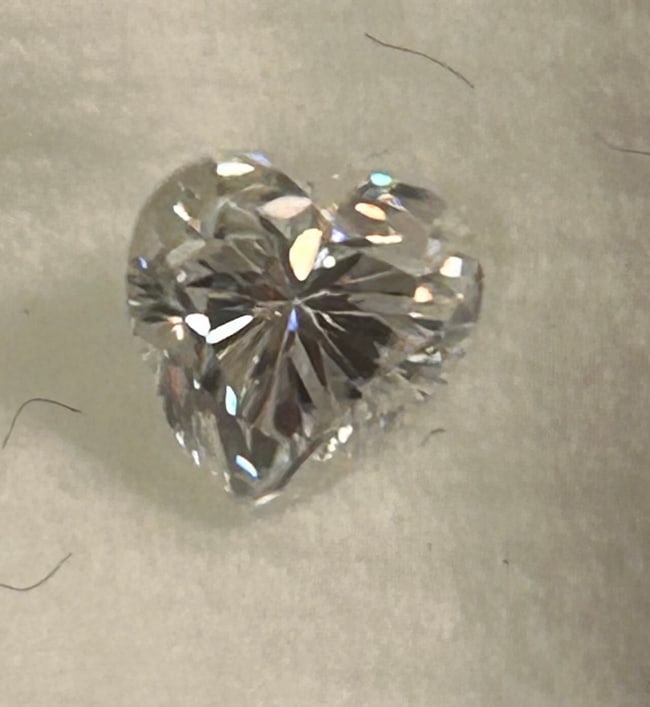 White Diamond 1ct Heart Cut from South Africa No Reserve Certified: Popular 1ct size offers significant presence while offering completely colorless. Icy white clarity. A modified brilliant fancy cut that maximizes sparkle. A romantic choice originating in South Afric