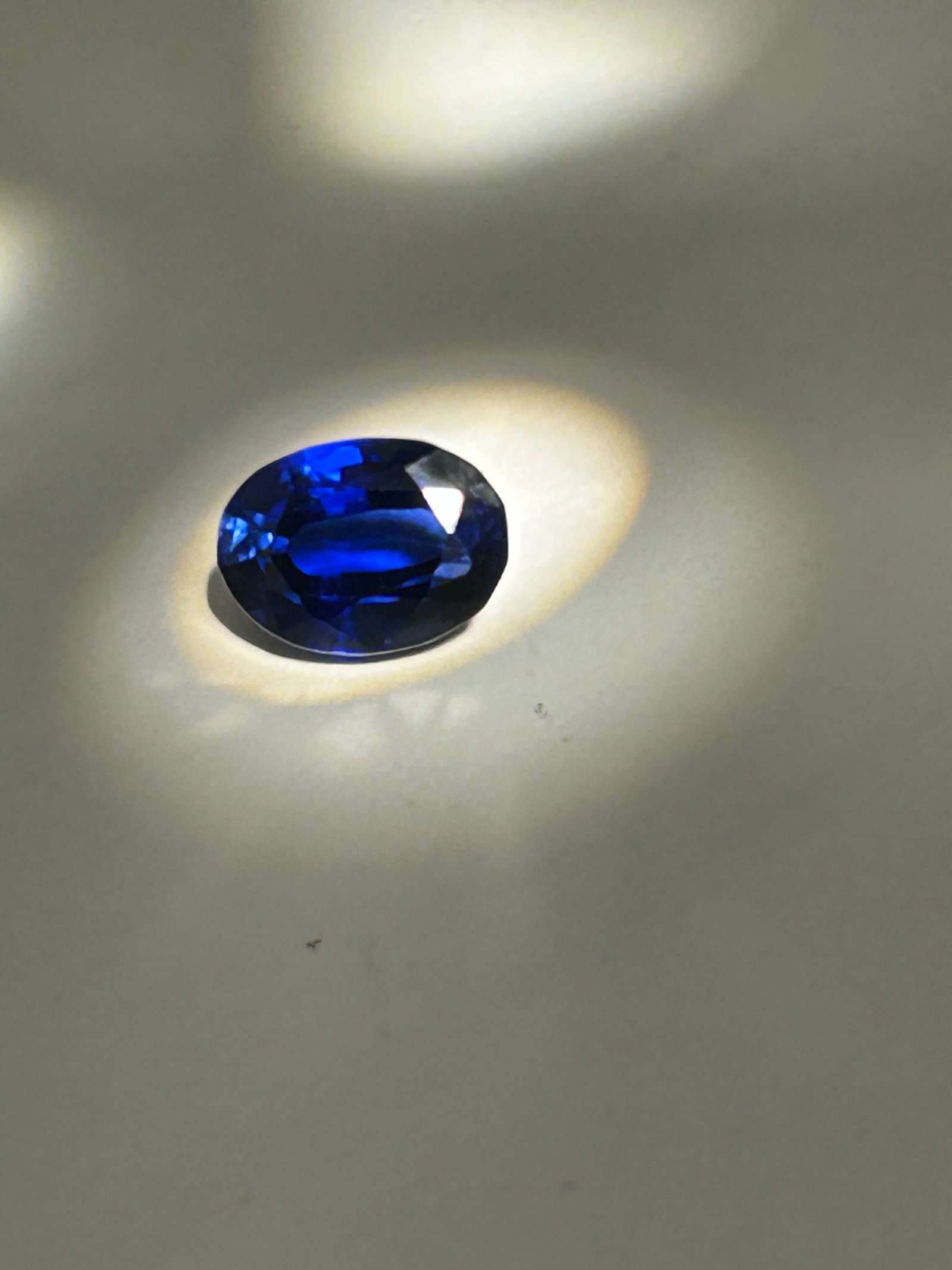5.1ct Brazilian DEEP Blue Sapphire Oval Cut No Reserve: Characterized by a rich, dark blue coloration indicative of its origin. Brazilian sapphires are generally darker than their Ceylon counterparts, with strong color saturation. They may exhibit minor na