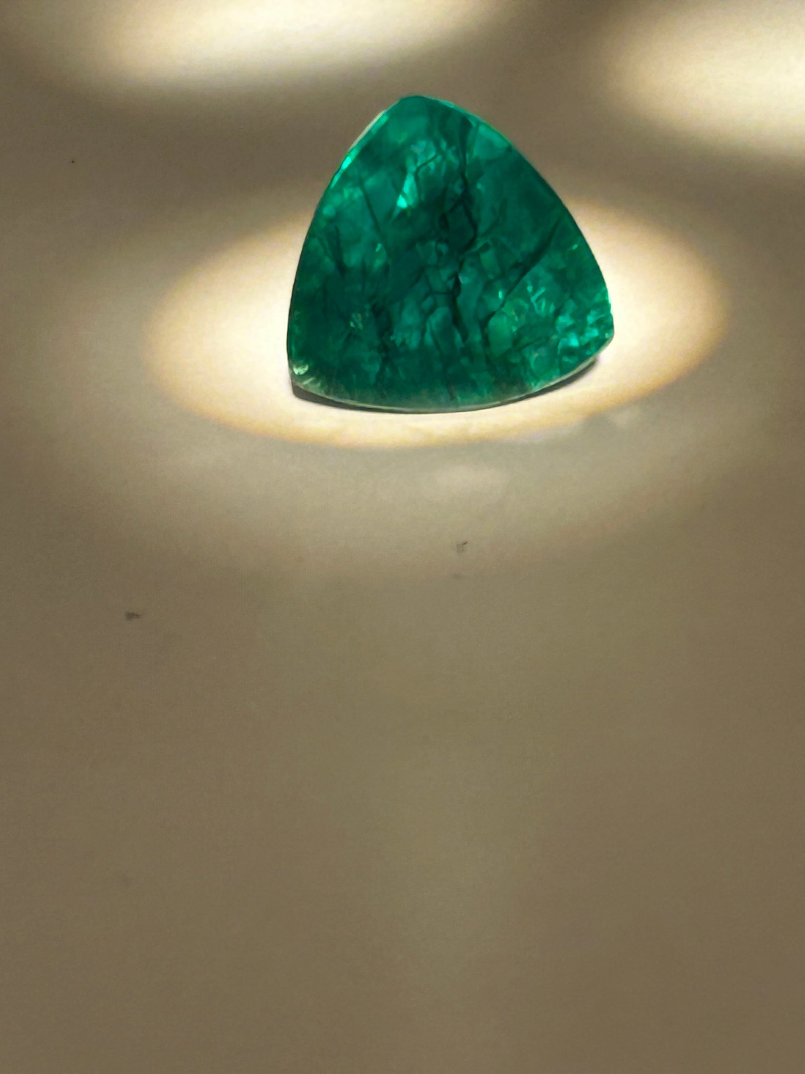 8.3ct Colombian Green Emerald Trillion Cut GGI Certified: a highly desirable gemstone, featuring a vibrant, vivid green hue. These high-carat gems are have refined cuts, offering exceptional clarity, brilliant luster, making them ideal for investment or luxu