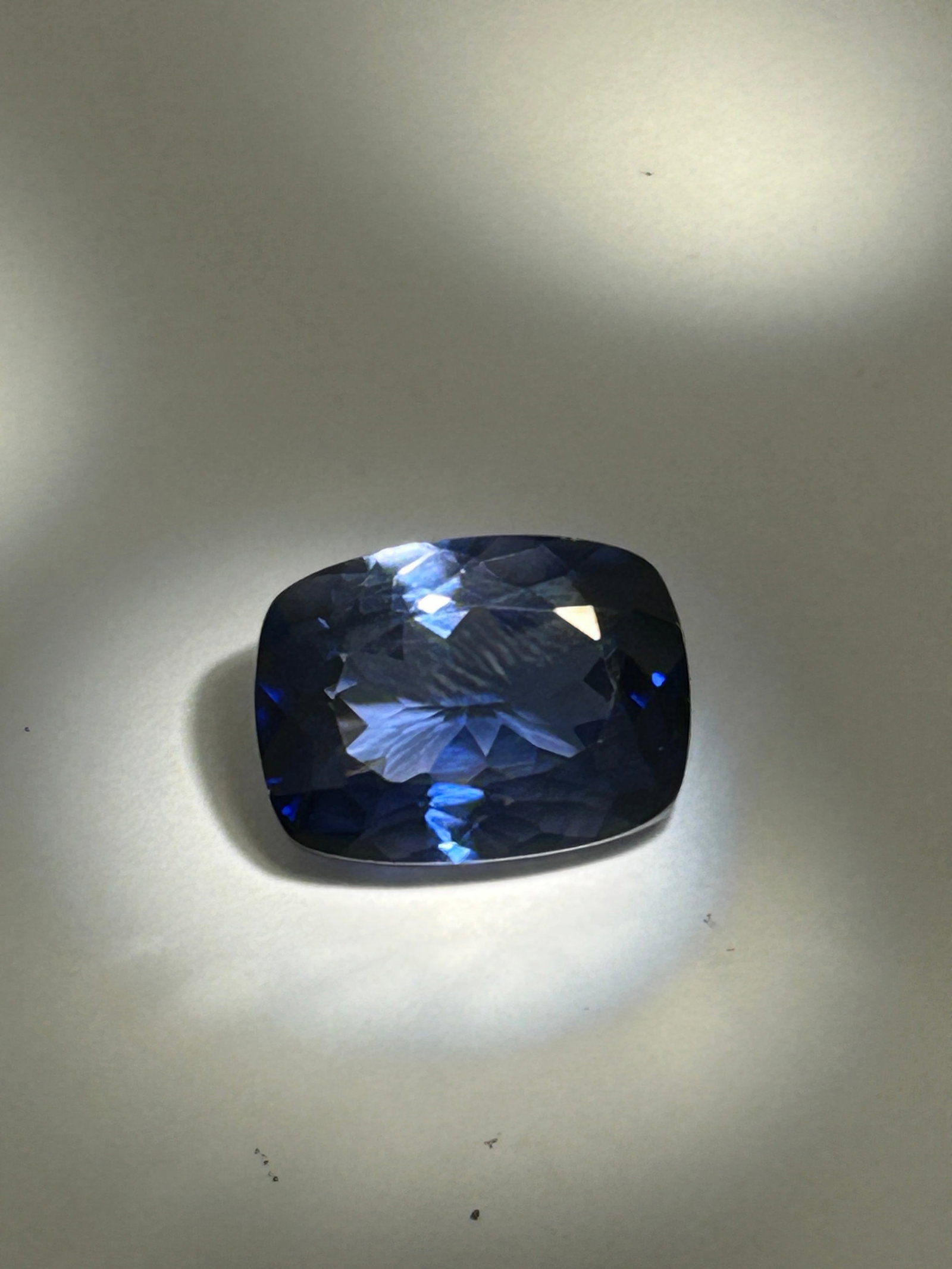 25ct Kashmiri Blue Sapphire Modified Cushion Cut EGL Certified: historically significant gemstone known for its velvety, "cornflower blue" color and "sleepy" glow caused by fine, silk-like inclusions. Cushion cuts are ideal for displaying this deep, soft color.