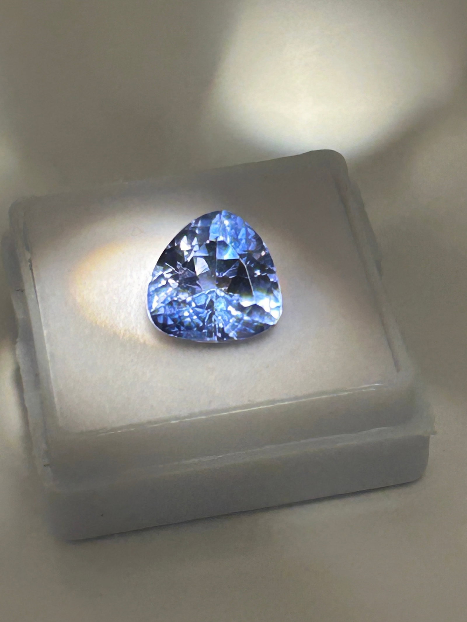 5.5ct Ceylon Light Blue Sapphire Trillion Cut No Reserve GGI Certified: A high-clarity gem originating from Sri Lanka, boasting superior brilliance and transparency. Trillion cuts enhance the bright, light blue tones, while Ceylon varieties are esteemed for their durabili