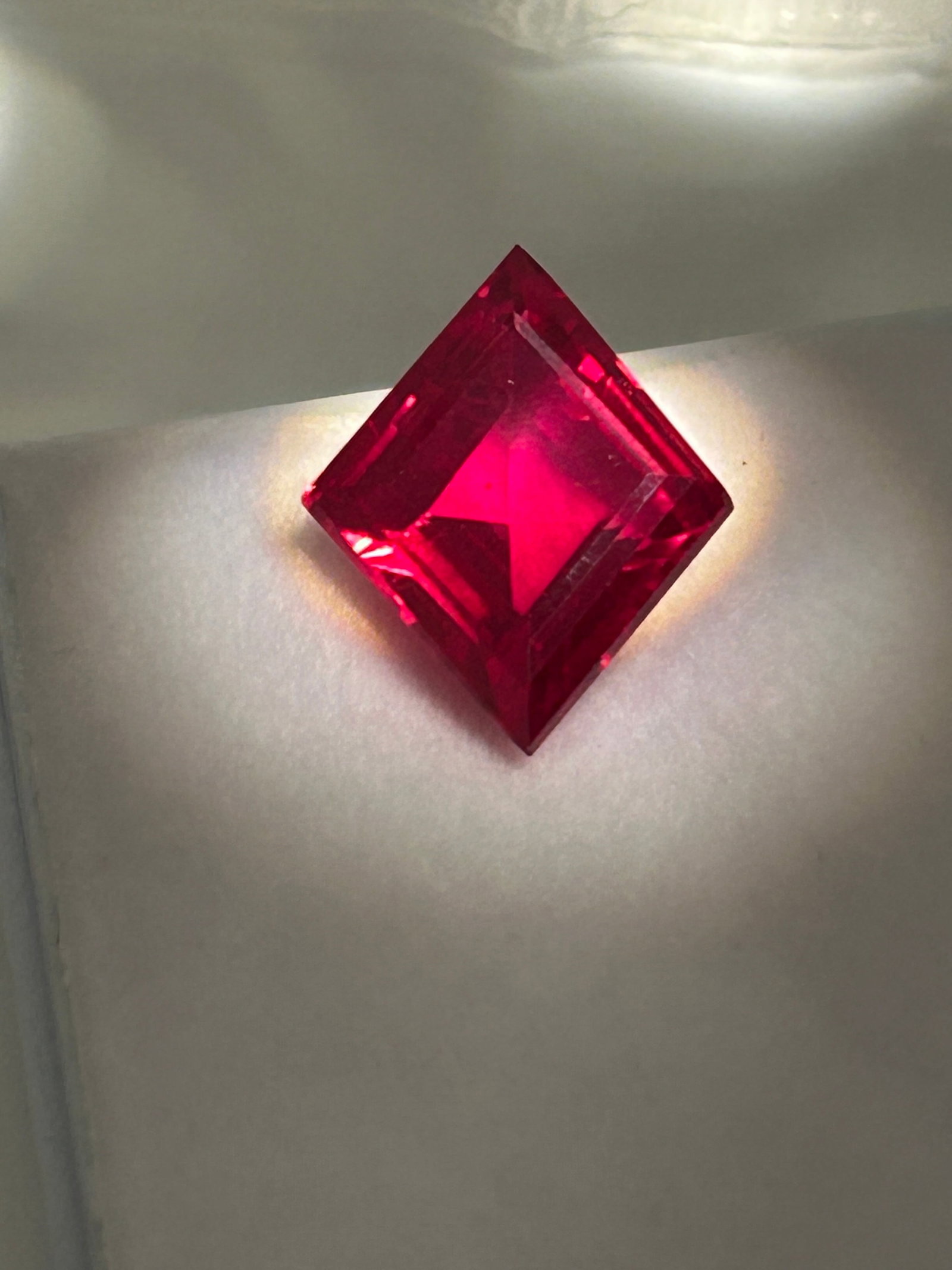 10.25 Carat Ceylon Red Sapphire Fancy Step Kite Cut EGL Certified: Incredible clarity and saturation. Ceylon Sapphires are highly prized for their vibrant, intense colors and high clarity.While technically a pink sapphire, it almost ruby like appearance would make a 