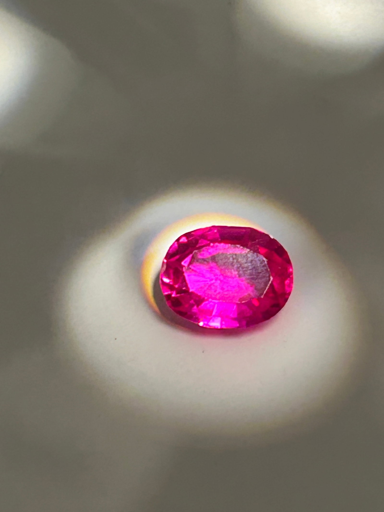 5.45 Carat Mozambique Pink Ruby Brilliant Oval Cut EGL Certified: Particularly in a brilliant oval cut, is a rare, high-value gem. Known for intense, vivid pink hue and high fluorescence, these stones are sourced from the Mogok Valley. The oval brilliant cut maximiz