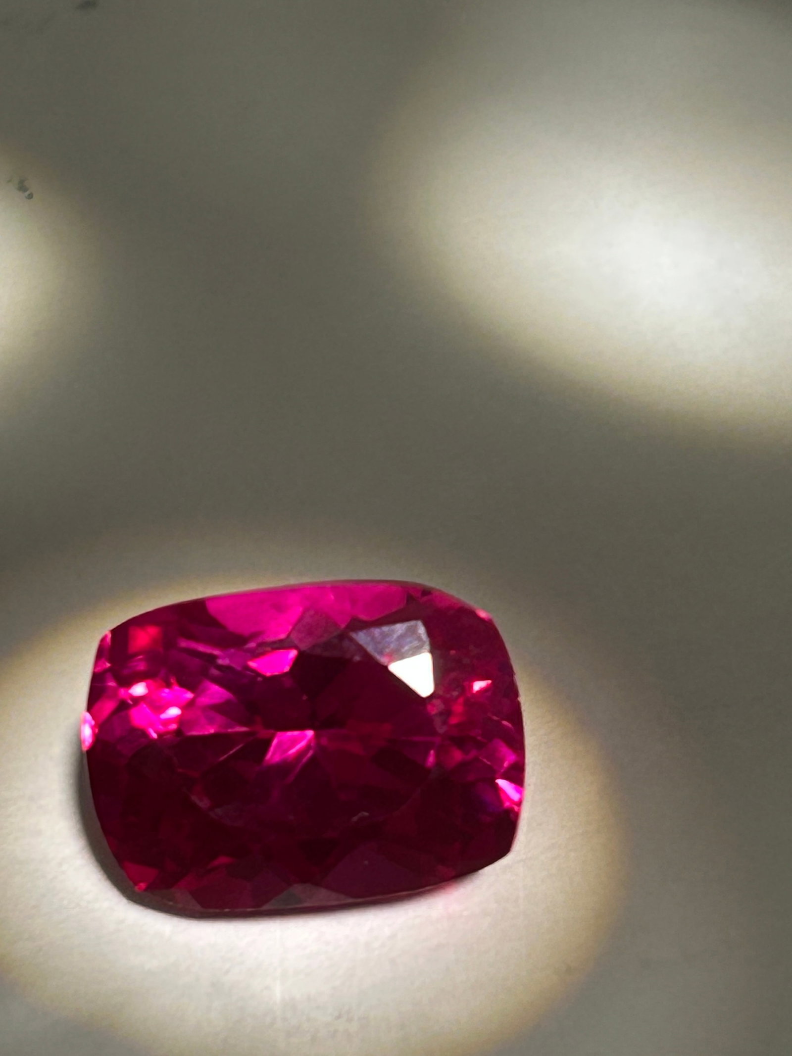12.85 Carat Sri Lankan Sapphire Cushion Cut EGL Certified: Known for superior clarity and vibrant color. Cushion-cut, it features a square or rectangular shape with rounded corners for a vintage, brilliant look. These gems feature high-quality, transparent ma