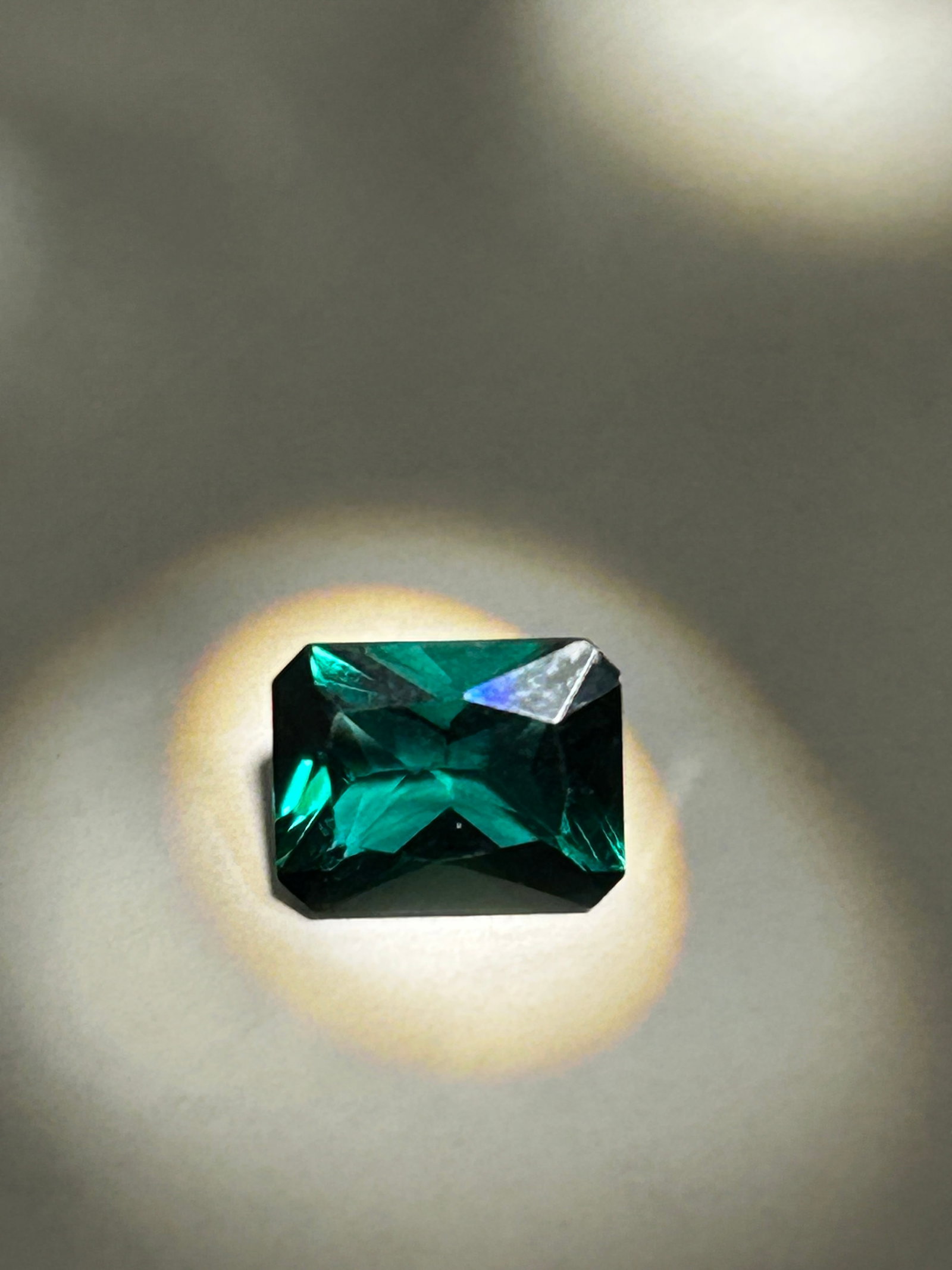 2.13 Carat Dark Green Emerald Emerald Cut IGI Certified Lab Grown: a substantial, tailored gemstone known for its clean, rectangular step-cut facets. Green quartz, often referred to in the trade as "emerald quartz," is a glassy, typically transparent variety of quart
