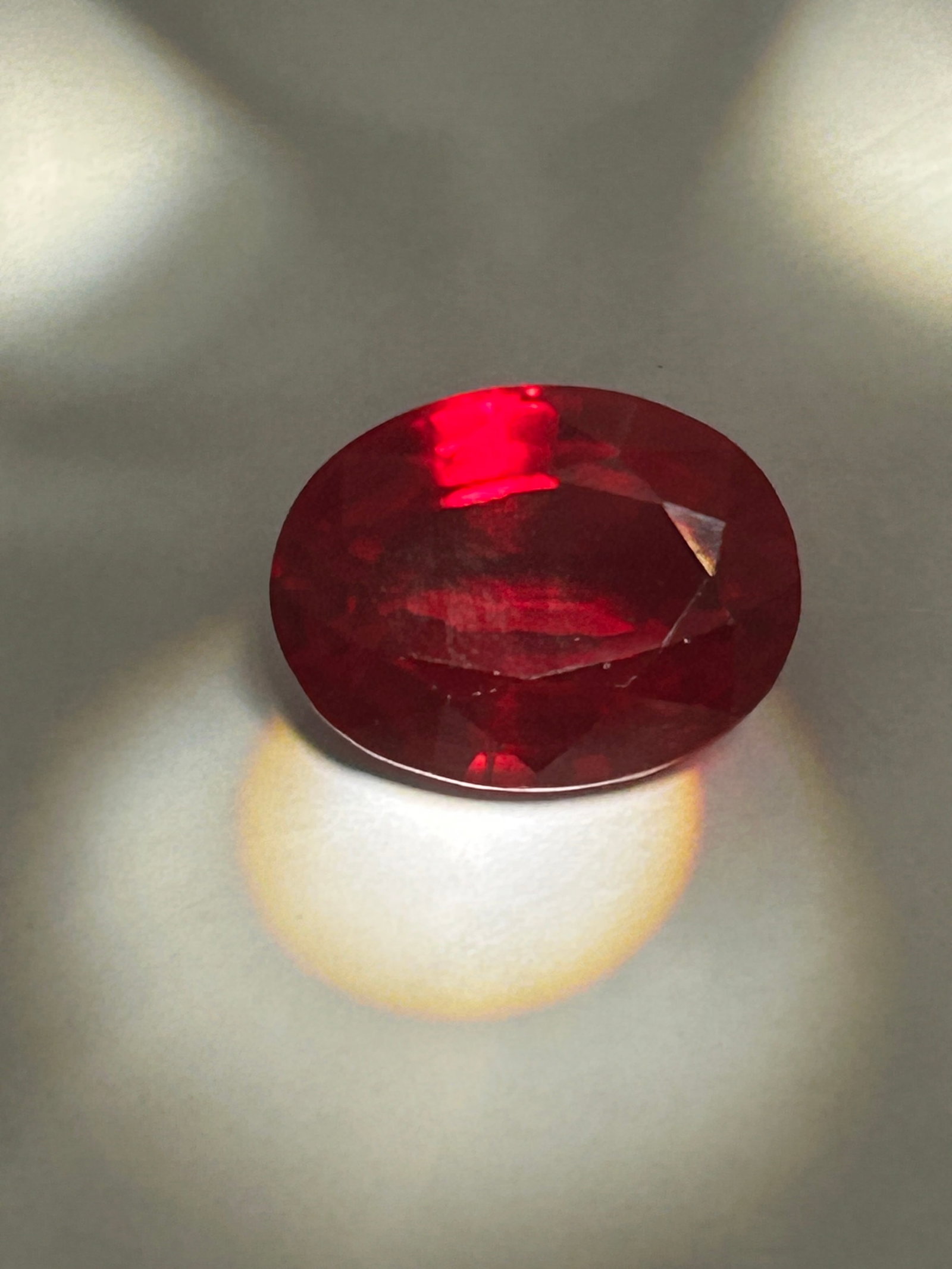 9.60 Carat Ruby Oval Cut GGI Certified: A deep, vivid red, sourced from Burma, which is the most valuable and sought-after color.