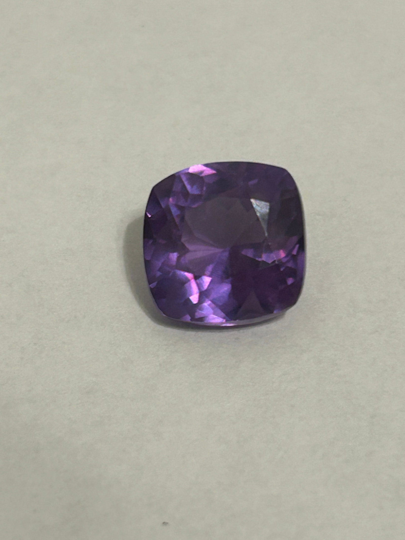 10.20 Carat Brazilian Alexandrite Cushion Cut EGL Certified: An exceptional gemstone, showcasing a distinct, dramatic color shift due to its origin. Brazilian alexandrites, particularly those from the renowned Hematita region, are prized for changing from a vib