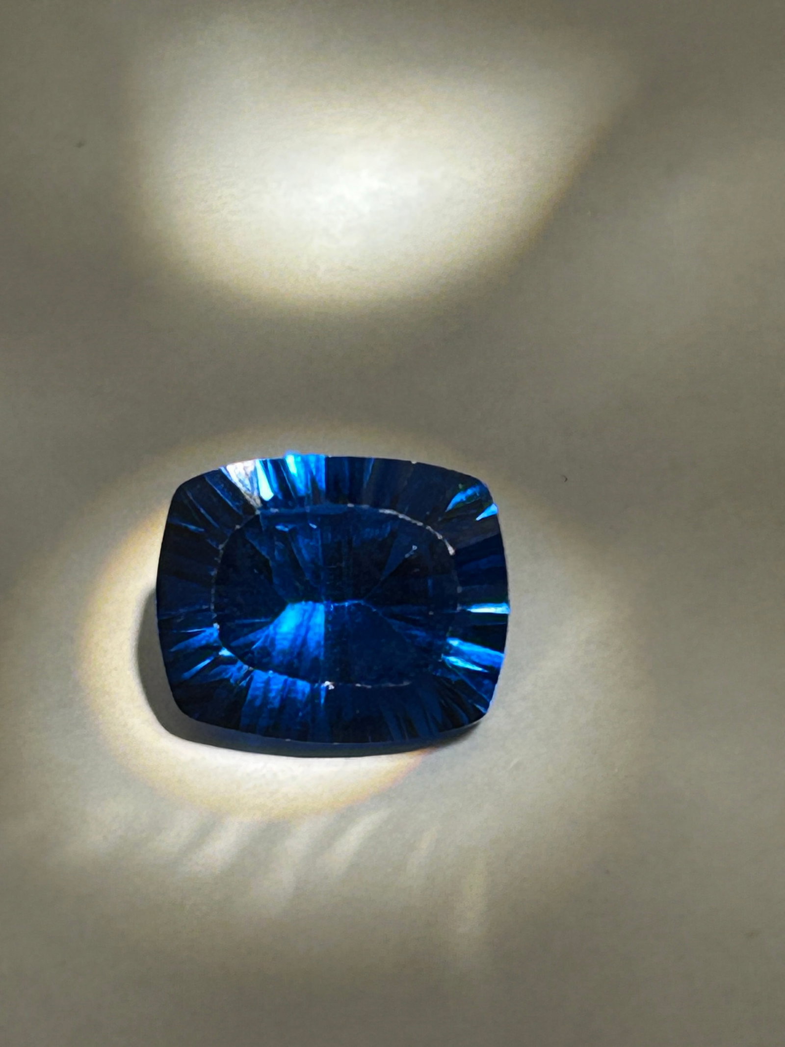 8.6 Carat Kenyan Blue Tsavorite Brilliant Oval Cut VG Certified: The finest stones originate from the Taita-Taveta district in Kenya. An 8.6-carat Kenyan blue garnet with a brilliant oval cut is an exceptionally rare and valuable collector’s piece. While traditio