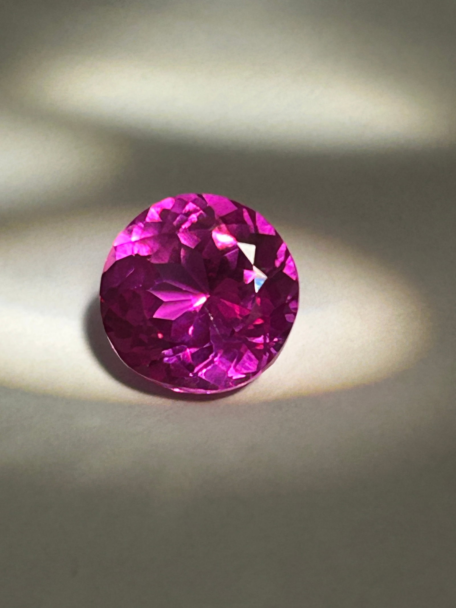 8.66 Carat Pink Sapphire Round Brilliant Cut IGI Certified Lab Grown: A high-clarity, and sustainable luxury gemstone. The lab-grown nature means the gem has the exact chemical, physical, and optical properties of a natural, high-quality pink sapphire.This is a terrific