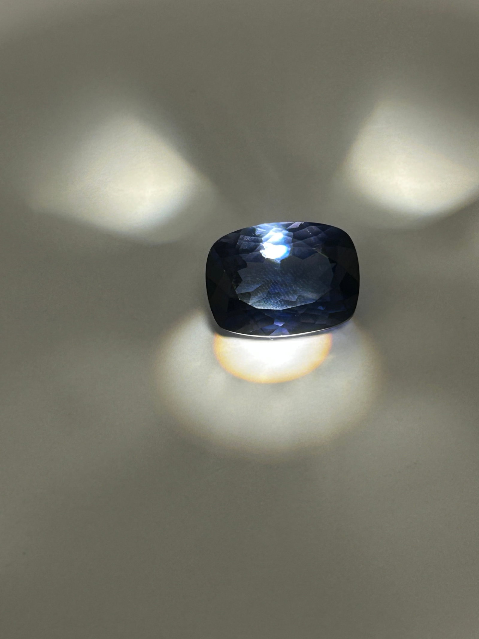 24.69 Carat Dark Blue Sapphire Modified Cushion Cut EGL Certified: A 24.69ct Blue Sapphire in an oval cushion cut is an exceptionally large, high-carat gemstone, likely designed as a collector's piece or a center stone for statement jewelry. This combination implies