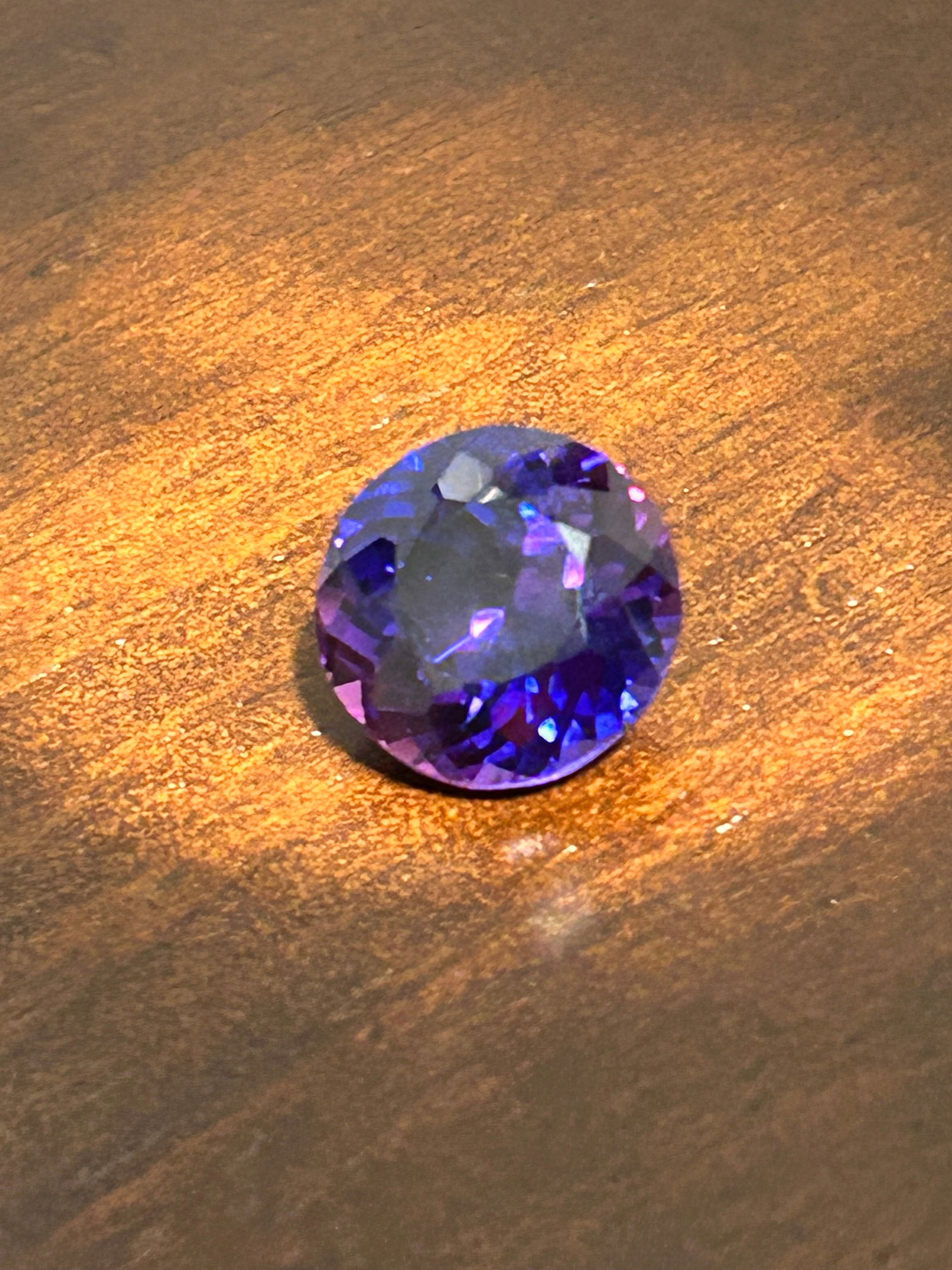 12.00 Carat Ceylon Java Plum Sapphire Round Cut: a high-carat-weight, natural, and rare gemstone, typically characterized by a deep, rich purple or violet-purple hue originating from Sri Lanka (formerly Ceylon). This specific color variety is