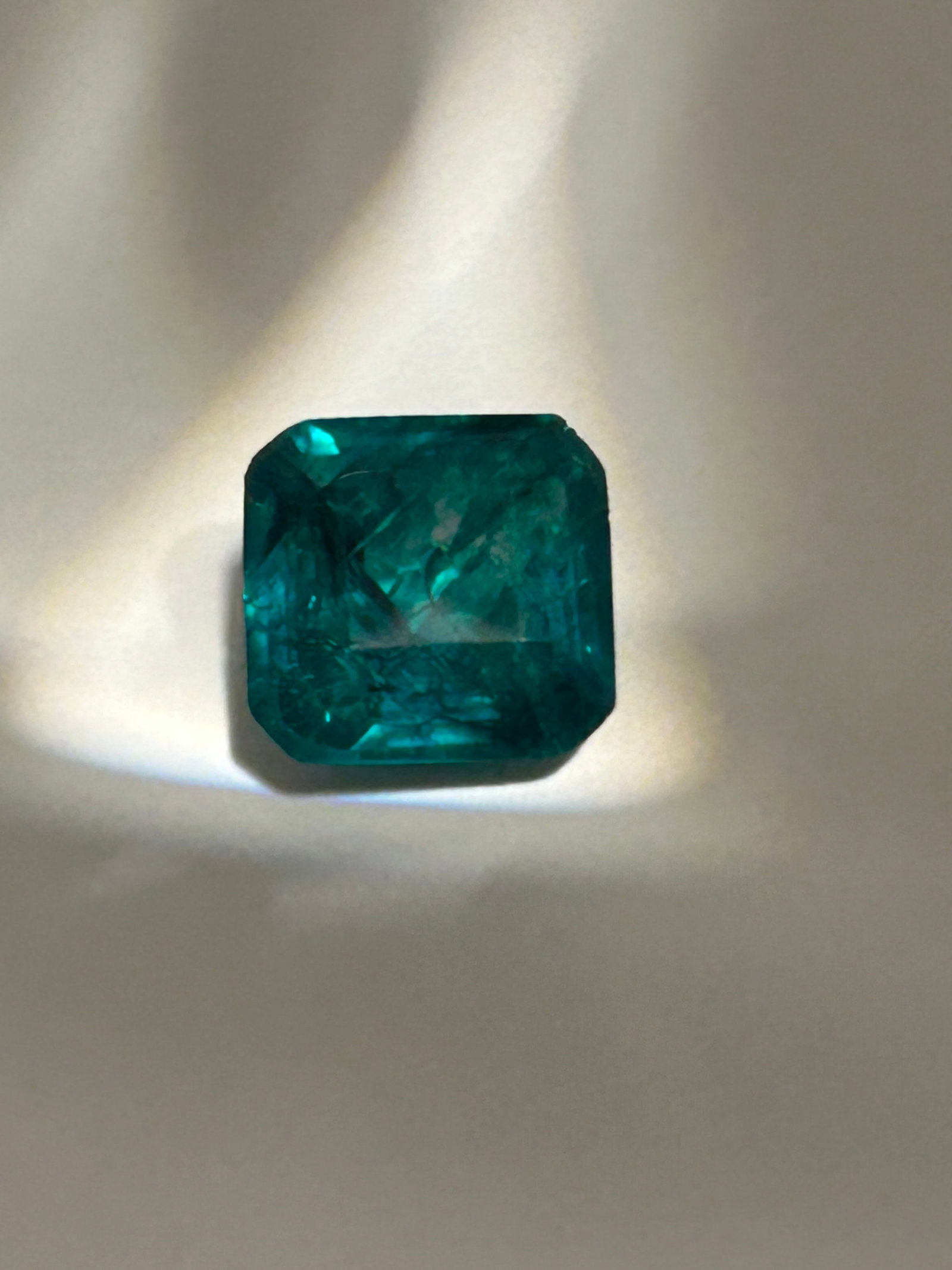 8 Carat Vibrant Green Emerald Unique Radiant Cut CG Certified: Combines the elegant, elongated silhouette of an emerald cut with the intense, multi-faceted sparkle of a brilliant cut. This specific cut features cropped corners to create a durable, octagonal outli