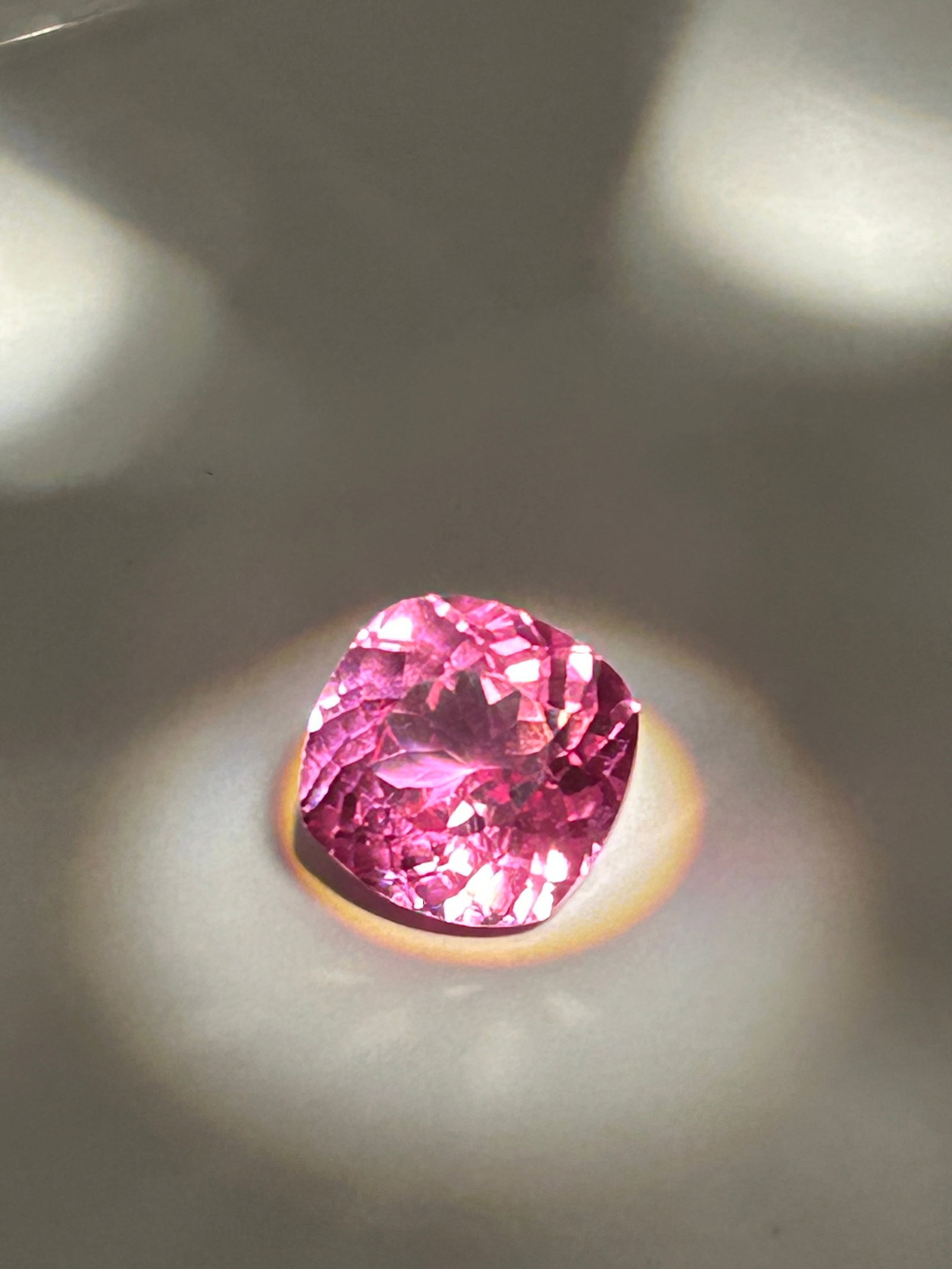 6.95 Carat Ceylon Padparadscha Sapphire Cushion Cut EGL Certified: Ceylon Padparadscha sapphire. Cushion-cut gemstone featuring a distinct lotus-pinkish-orange hue. Rated as AAA quality and eye-clean, it exhibits excellent brilliance, high transparency, and a romanti