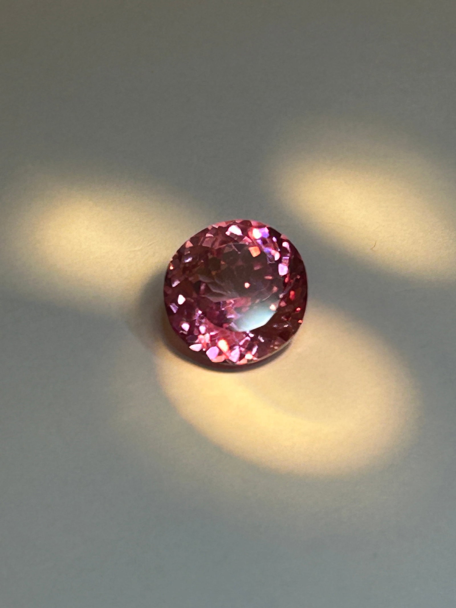 15 Carat Absolutely Beautiful Padparadscha Sapphire Round Cut CG Certified: Investment Grade. A "sunset-like" blend of pink and orange. These large stones are highly sought after by collectors A true, desirable Padparadscha shows a delicate, vibrant blend of pink and orange. 