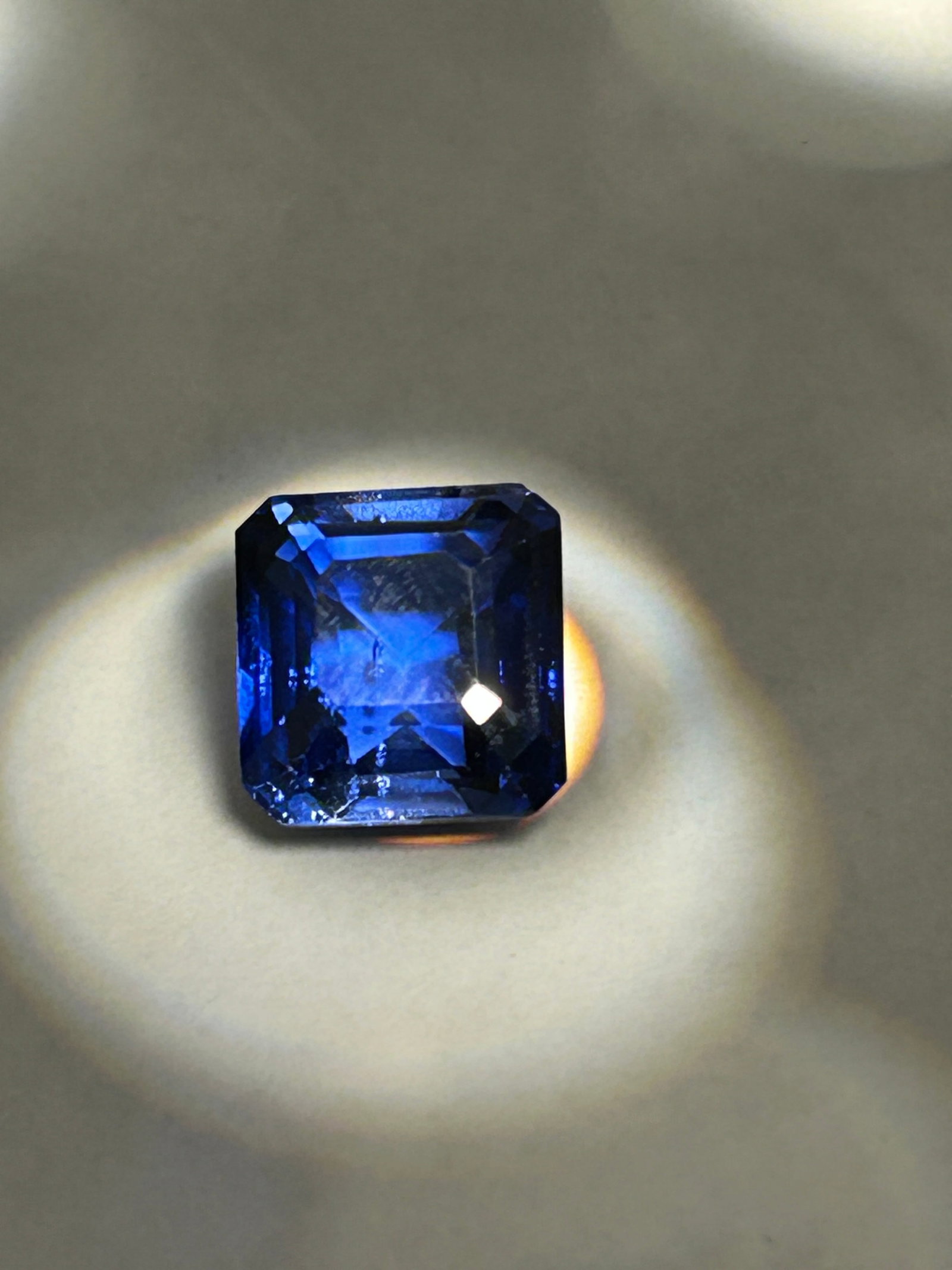 9.25 Carats Blue Sapphire Radiant Cut GGI Certified: A blue sapphire is a substantial gemstone cut in a radiant style, designed to maximize brilliance with a combination of emerald and brilliant-cut facets. Featuring a deep blue hue, For a luxurious,