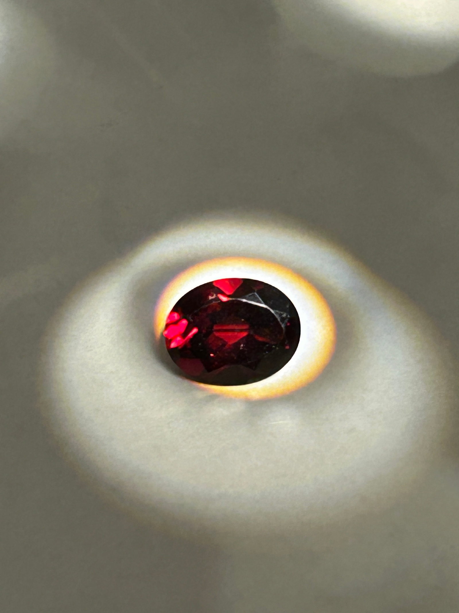 2.22 Carats Almandine Garnet Oval Cut IGI Certified: a natural, deep red to purplish-red gemstone, frequently cut in an oval shape to maximize its light reflection and beauty. These garnets are known for their deep wine-red, burgundy, or brownish-red co