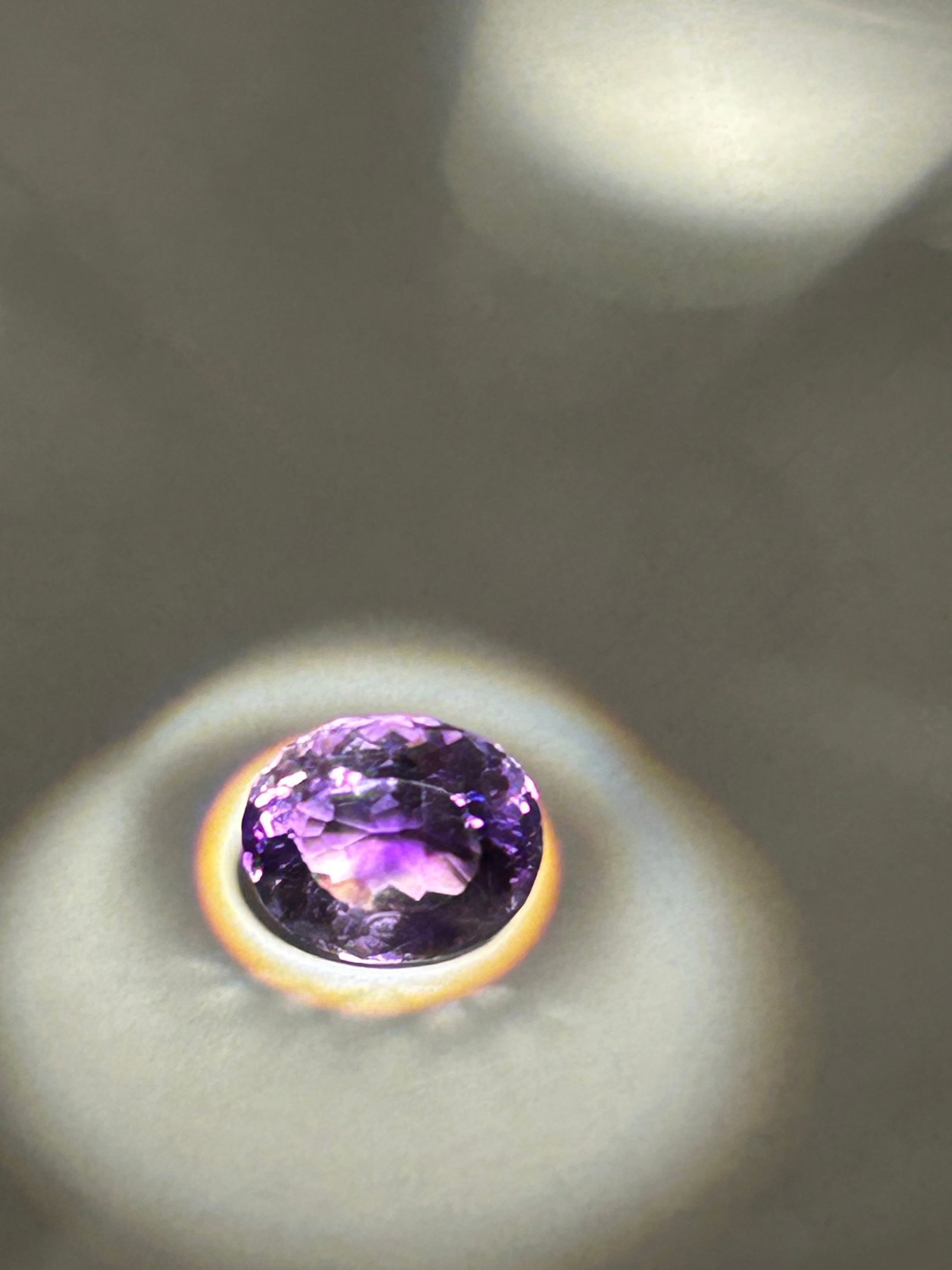 2.45 Carat Sparkling Purple Amethyst Oval Cut IGI Certified: A 2.45-carat sparkling purple amethyst with an oval cut is a popular choice for jewelry, often featured as a vibrant center stone in rings or pendants
