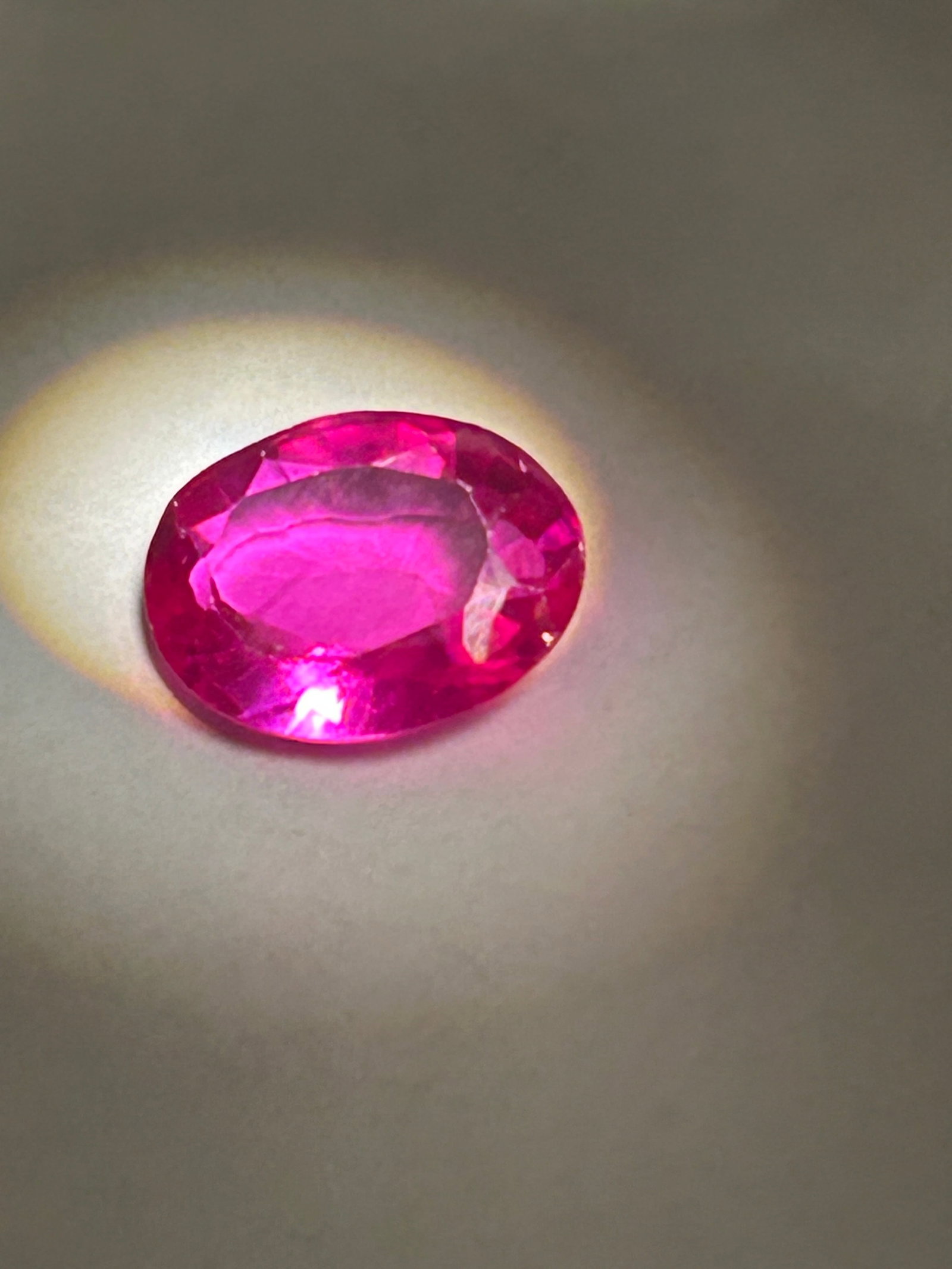 5.70 Carat Pink Sapphire Oval Cut GGL Certified: natural stones over 4 carats are seldom found in high-quality grades. This specific size offers a significant surface area for an oval cut, which is designed to maximize both the stone's final weight 
