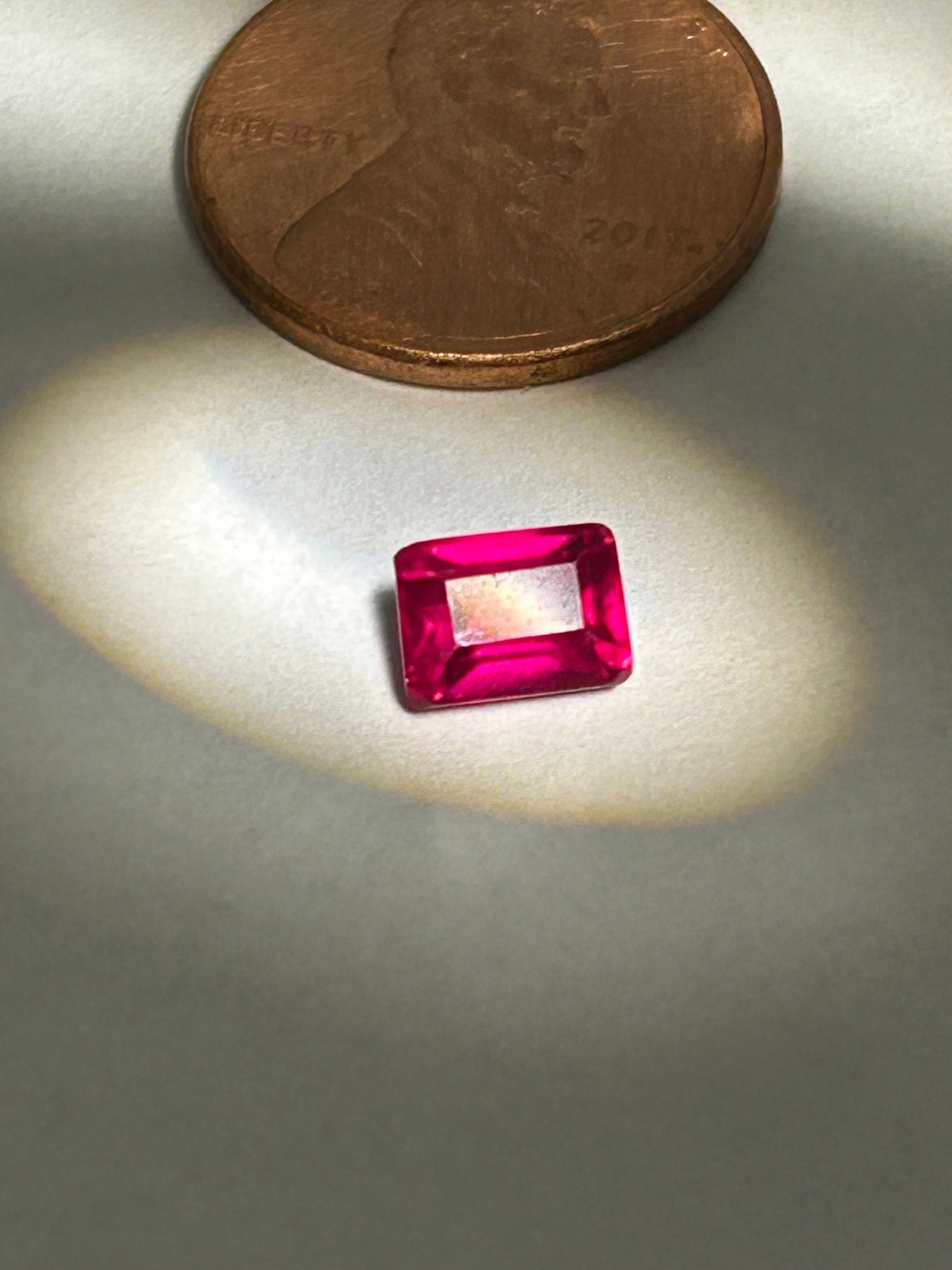 1.50 Carat Blood Red Ruby Baguette Cut GGI Certified: a rare and highly specialized gemstone, often sought for its intense, vivid color and sleek, geometric, step-cut facet pattern. "Blood red" typically refers to the coveted "pigeon blood" hue, which is