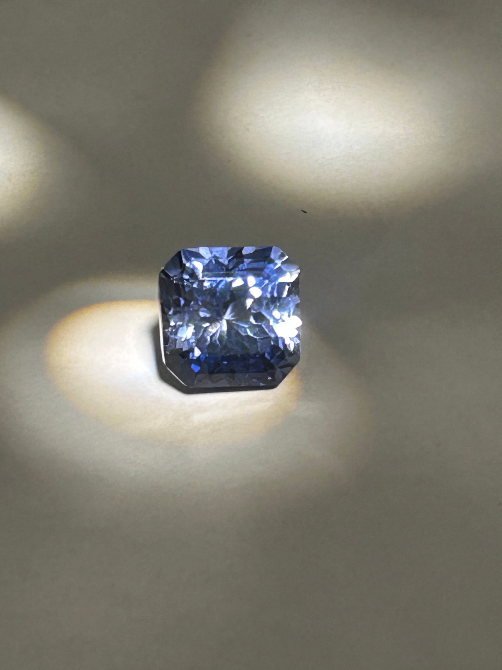 8.41 Carat Blue Sapphire Square Emerald Mixed Cut IGI Certified Lab Grown: Beautiful Stone. Substantial size and specialized faceting. This specific combination typically features the clean, "hall of mirrors" linear steps of an emerald cut on a square frame (often called an 