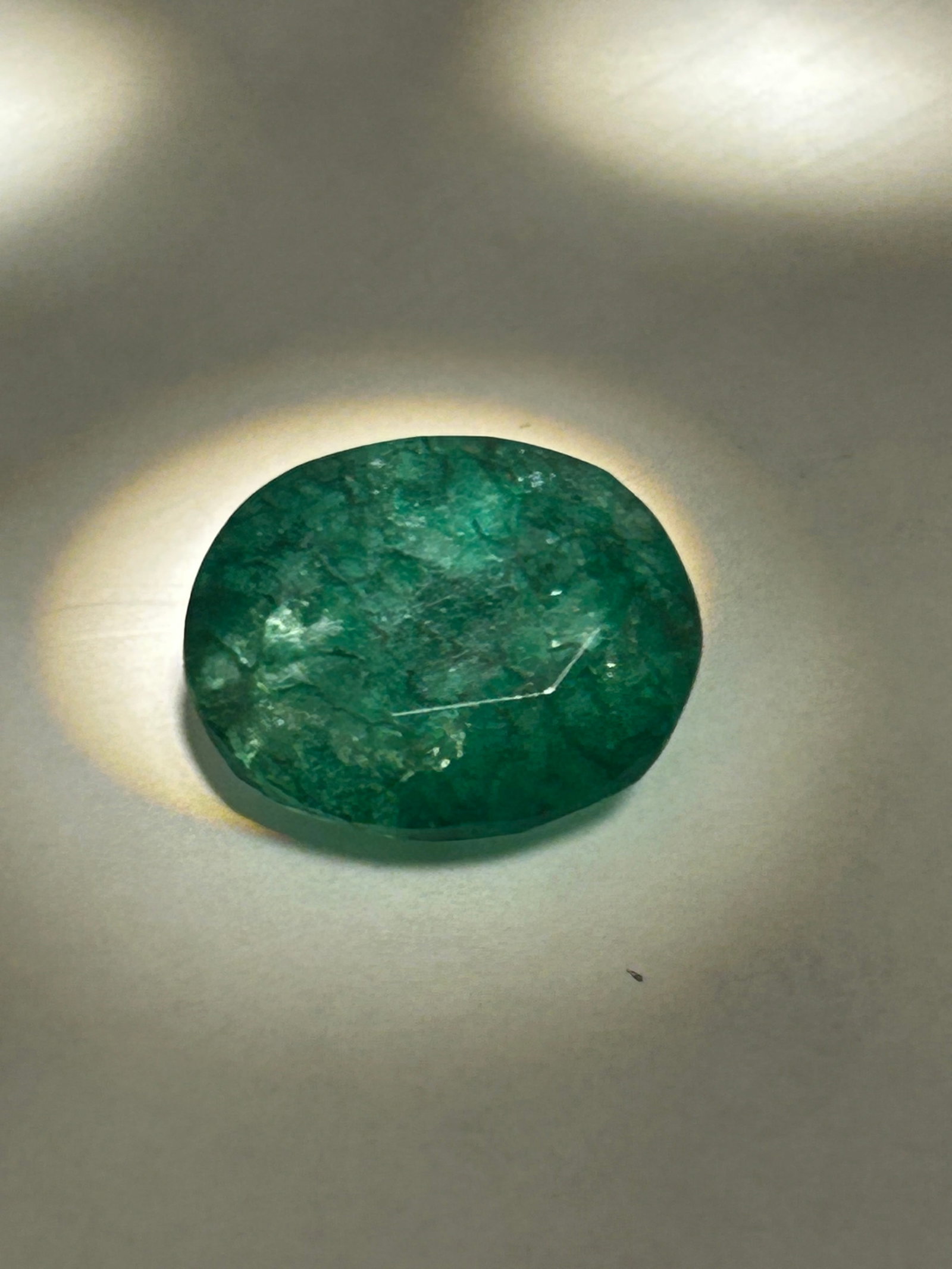 10.25 Carat Colombian Green Emerald Mixed Cut: Beautiful Stone. Substantial size and specialized faceting. This specific combination typically features the clean, "hall of mirrors" linear steps of an emerald cut on a square frame (often called an 