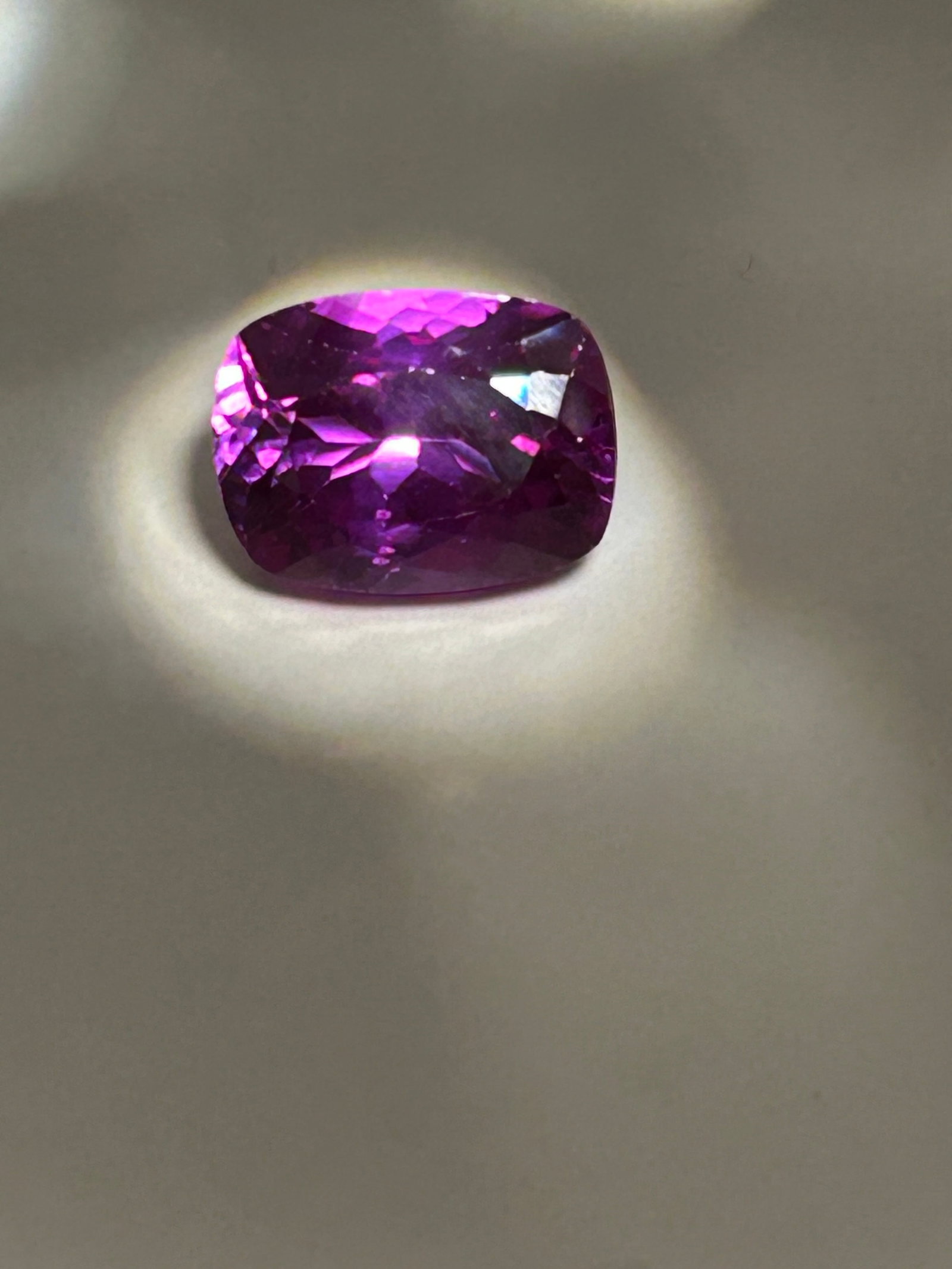 15.5 Carat ---- Sri Lankan Raspberry Sapphire ---- Modified Cushion Cut: A vibrant, vivid color. Modified cushion cuts combine a rounded, pillow-like silhouette with mixed brilliant facet patterns, maximizing light reflection, brilliance, and scintillation. Exciting unique