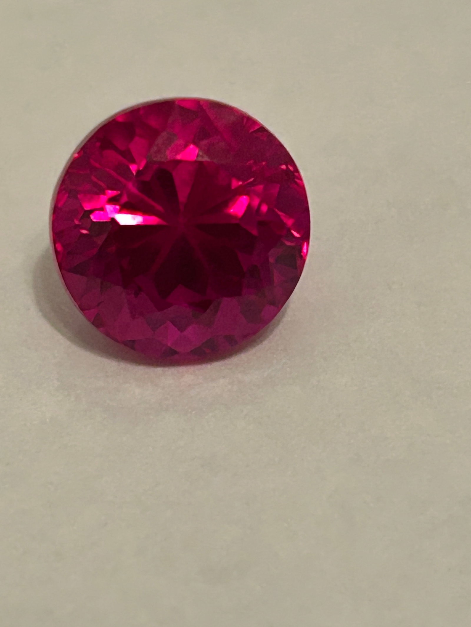 11.45 Carat ---- Pink Ruby---- Brilliant Round Cut ---- EGL Certified: he Brilliant Round Cut features expertly placed facets designed to maximize light reflection, ensuring high brilliance and excellent clarity. The stone displays a vivid pinkish-red hue. It is typicall