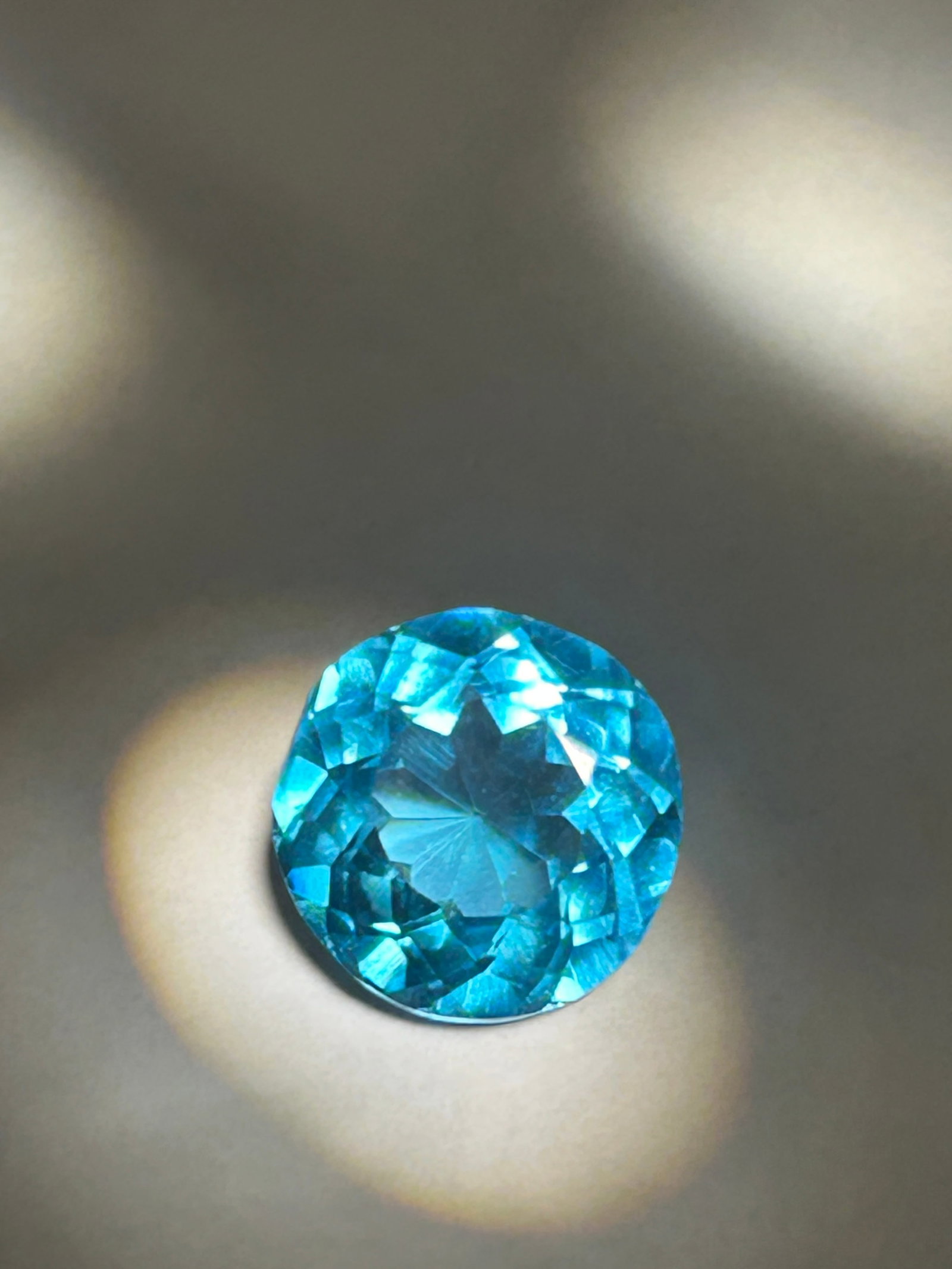 8.46 Carat ---- Brazilian Neon Tourmaline---- Round Cut ---- GIE Certified: These stones are frequently sourced from Brazil and are known for their "neon" or "electric" blue-green to greenish-blue colors caused by copper content.