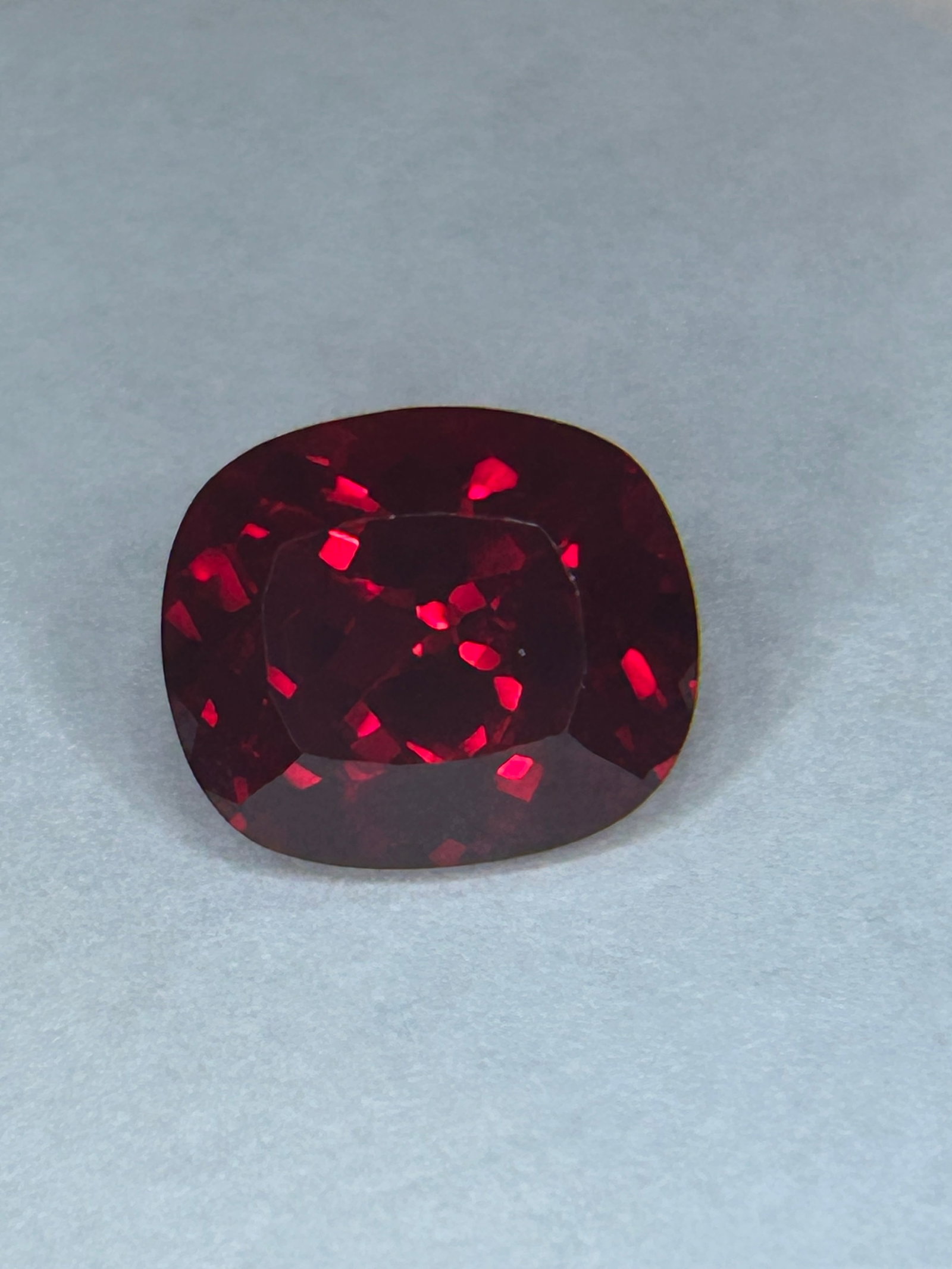 8.50 Carat ---- Blood Ruby---- Cushion Cut ---- GGI Certified: An exceptionally large, high-value, and deeply colored gemstone, typically originating from regions like Mozambique. The term "Pigeon Blood" refers to a vivid, intense red color—often with slight pu