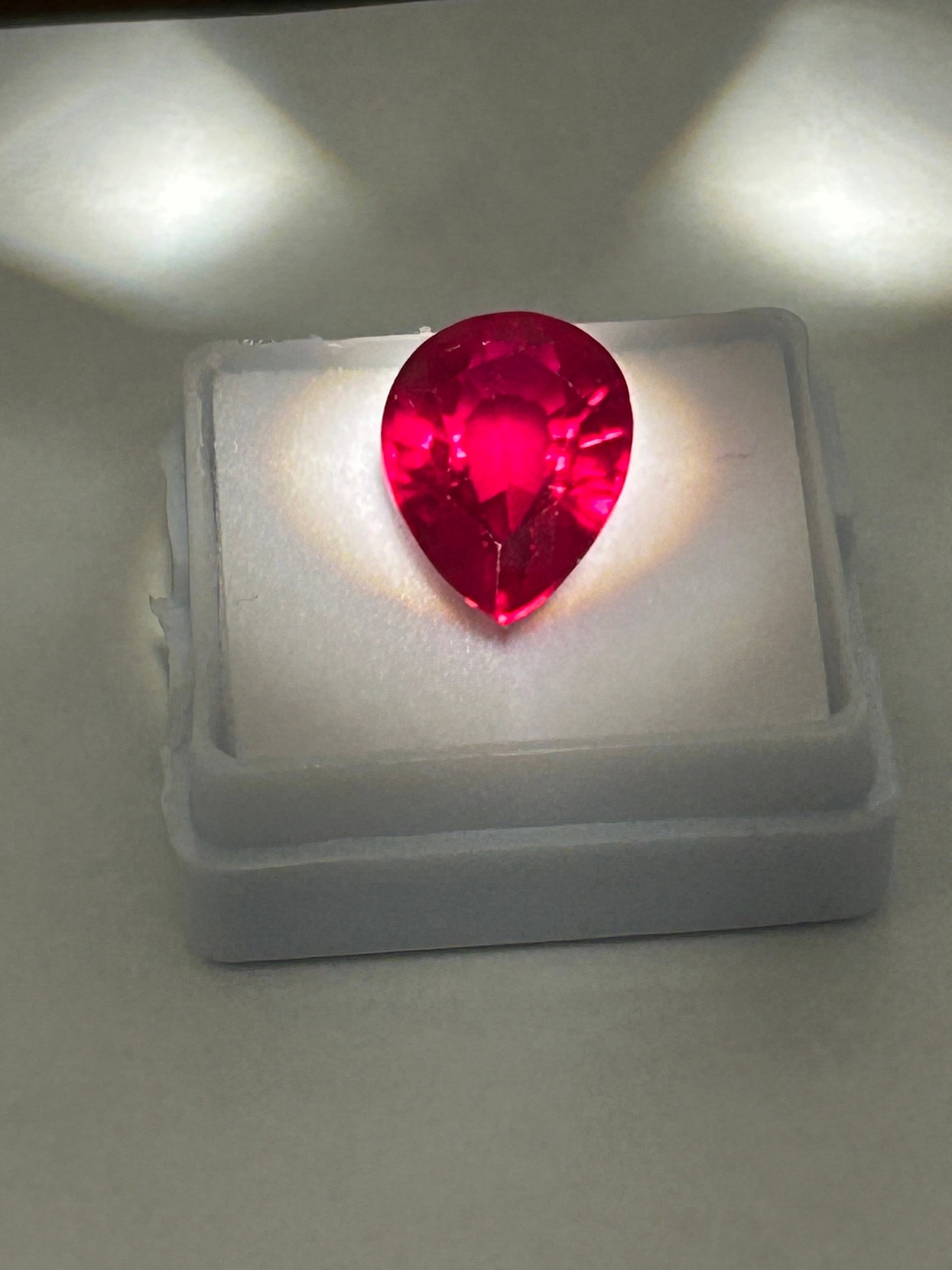 11.00 Carat ---- Blood Ruby---- Pearl Cut ---- GGI Certified: Teardrop-shaped gemstone, featuring a brilliant-cut crown for maximum sparkle. Showing a vibrant red to pinkish-red color with eye-clean clarity. The pear shape is designed to look large per carat, ma