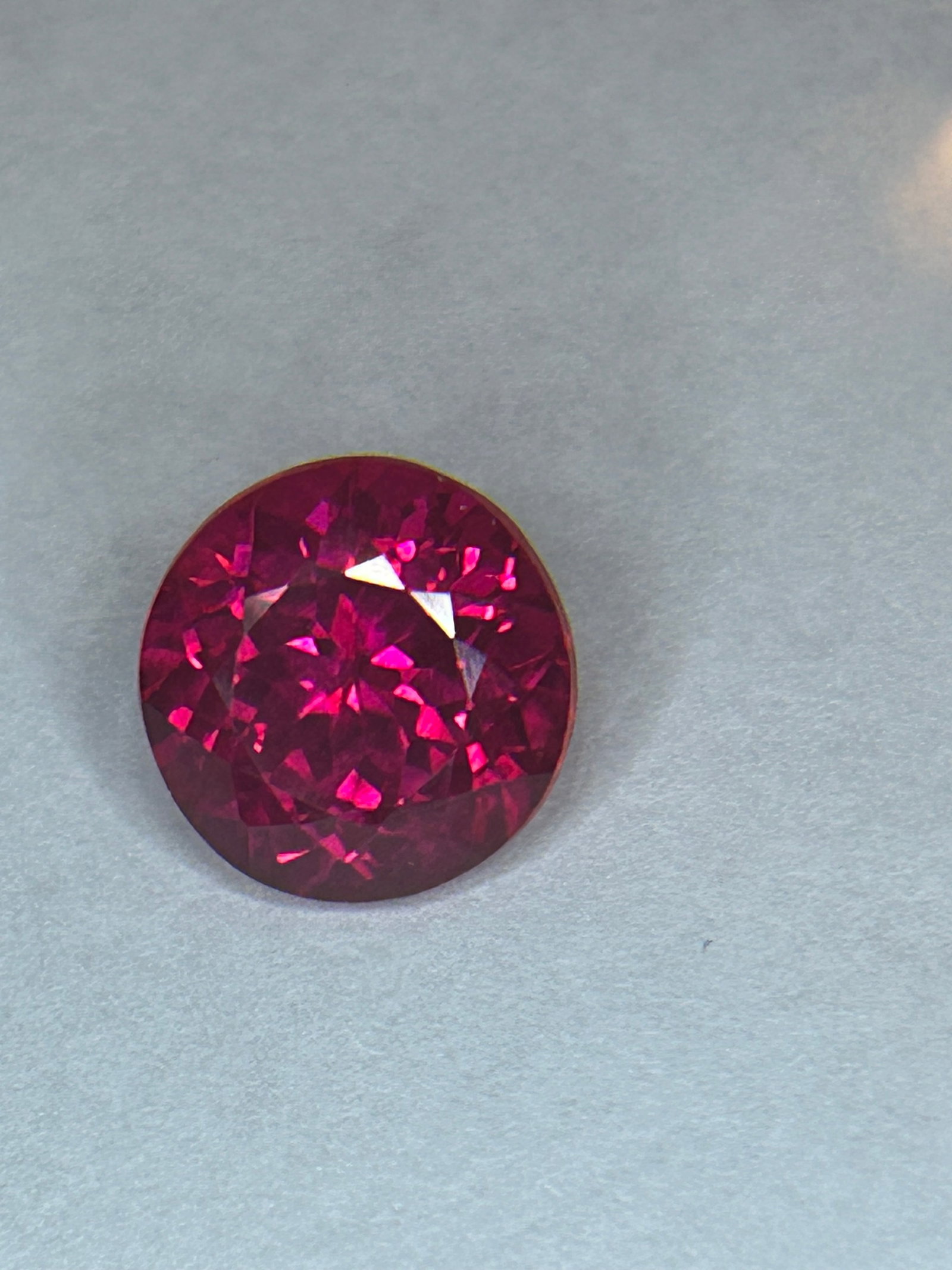 10.60 Carat ---- Wyoming Red Ruby ---- Round Cut ---- EGL Certified: a large, top-quality American ruby, from the Rodeo Queen Mine near Cheyenne, Wyoming, is highly desirable to collectors.A Highly valued gemstone. An oval cut, creating a large deep red color and impro