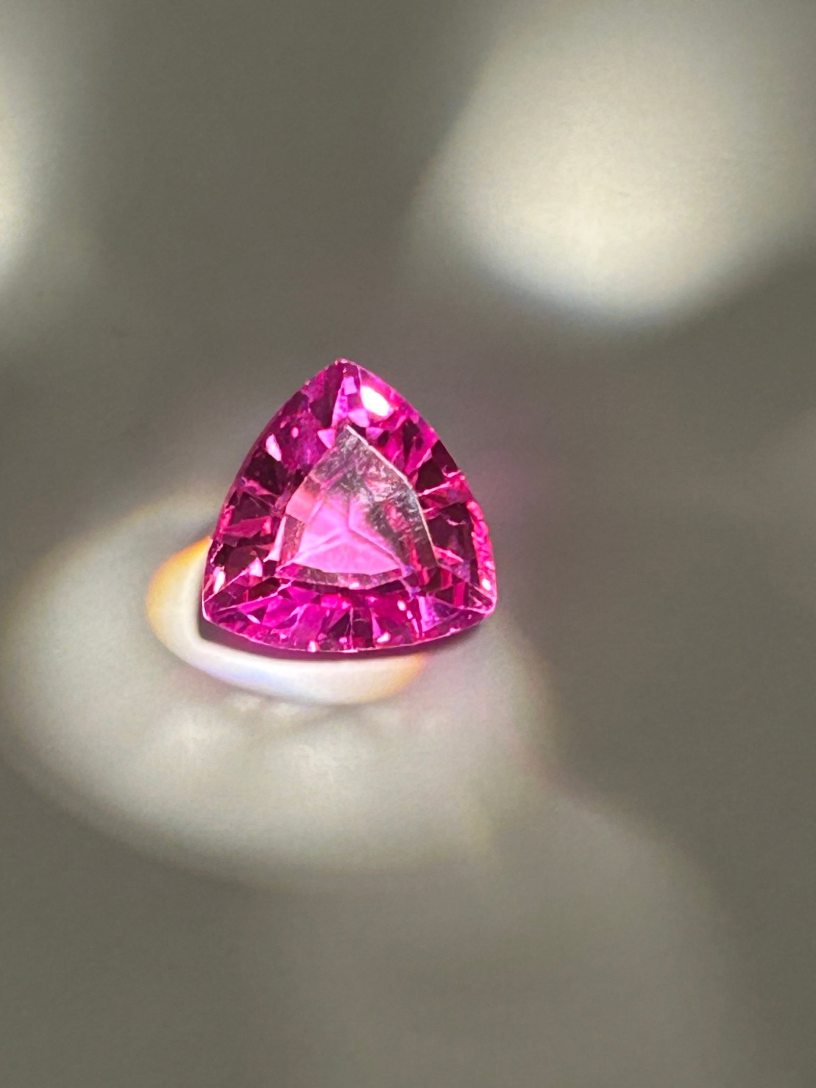 12.55 Carat--- Ceylon Pink Sapphire ---- Trillion Cut----EGL Certified: Tremendous clarity graces this gemstone. Evaluated at eye level, it carries very slight inclusions, mere reminders of its earthly birth, adding authenticity to its ethereal glow. The vivid color inten