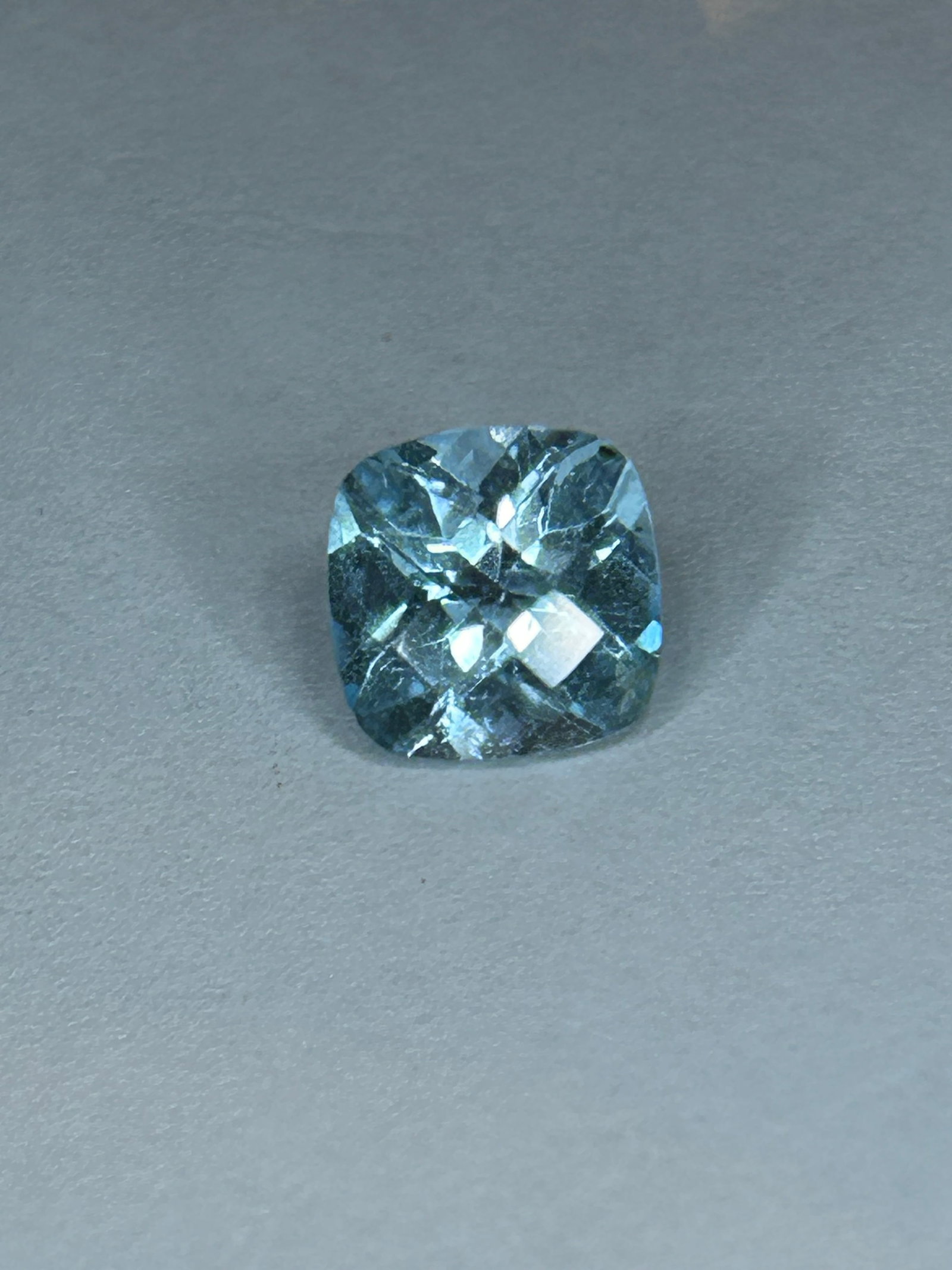 3.7 Carat --- Brazilian Blue Topaz --- Cushion Cut: Brazilian blue topaz in a cushion cut is a highly sought-after gemstone, exhibiting vibrant, lighter, serene sky blue. Originating from Brazil, it features excellent brilliance, with high clarity.