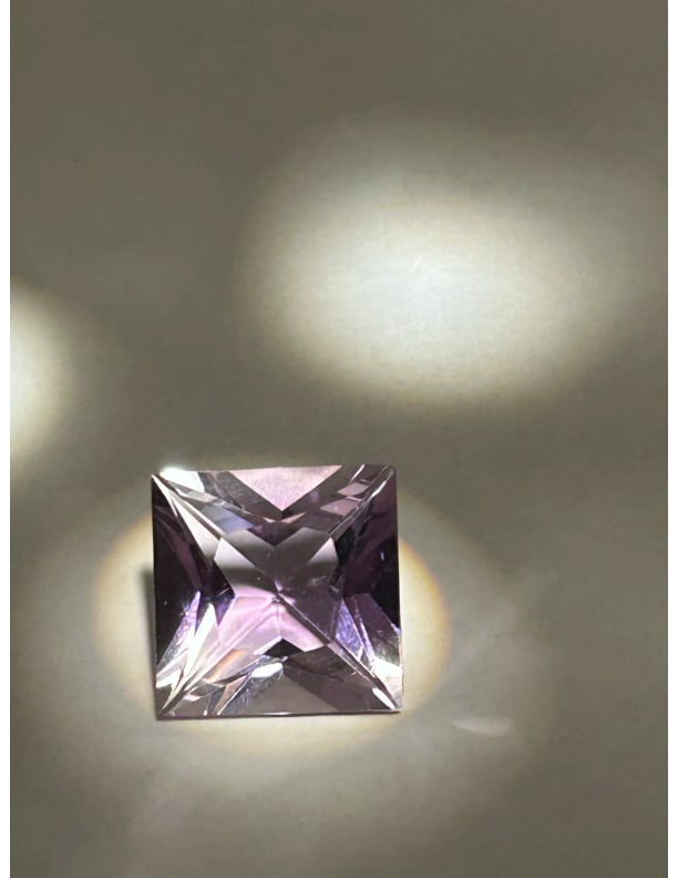 10.98 Carat --- Soft Purple Amethyst --- Radiant Cut --- IGI Certified: A 10.98-carat soft purple radiant-cut stone is an exceptionally large, high-value gem that combines significant weight with a modern, high-brilliance facet pattern. With a soft tone, the radiant