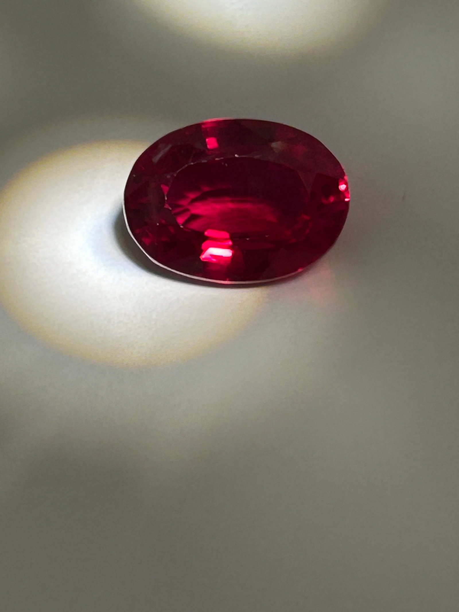 9.6 Carat --- Mozambique Ruby ---Oval Cut ---- GGI Certified: a substantial, highly coveted gemstone known for its intense, deep-red hues and excellent clarity. Mozambique is celebrated for producing vibrant rubies that often appear eye-clean. The classic oval c
